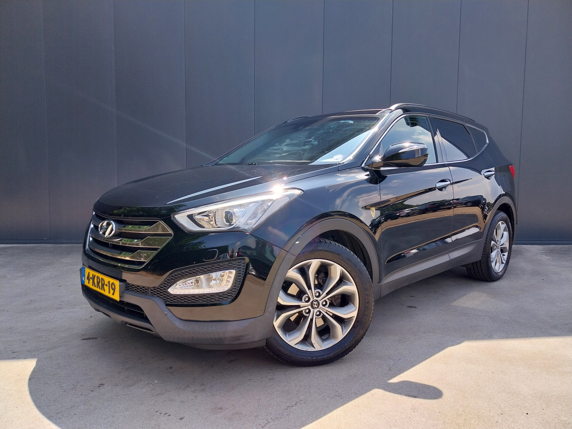 Hyundai Santa Fe 2.4i GDI 4WD i-Catcher OPEN DAK CAMERA CRUISE ECC NAVI XENON LED LEER TREKHAAK 4X4 2013 - voorkant
