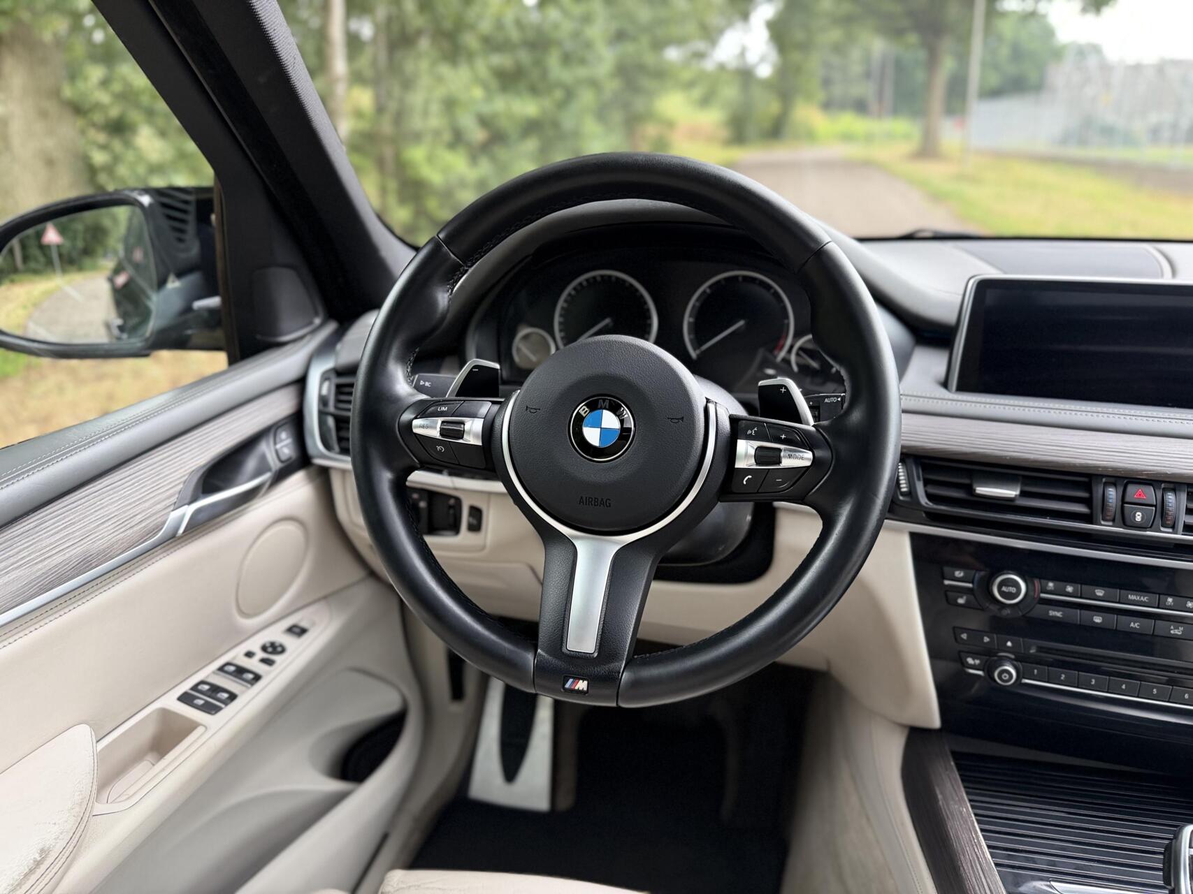 Foto van BMW X5 M50d