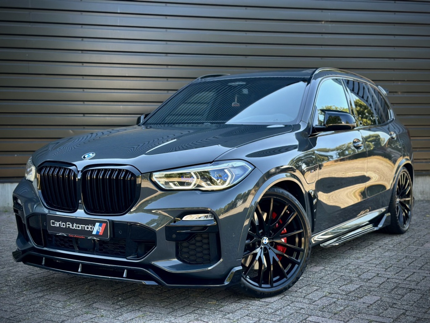 BMW X5 Xdrive45e xDrive45e M-PERF. LASER|PANO|HUD|360|H/K|4WL STURING|MASSAGE 2021 - voorkant