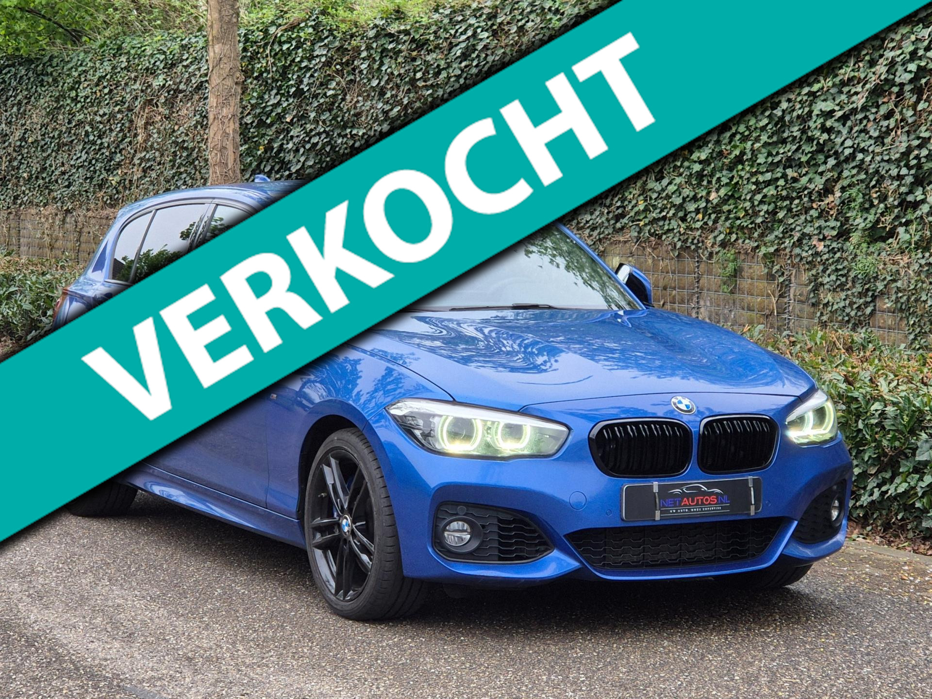 BMW 1-serie 120i Edition M Sport Camera CarPlay Adaptieve LED Cruise Navi LCI Shadow High Executive 2018 - voorkant