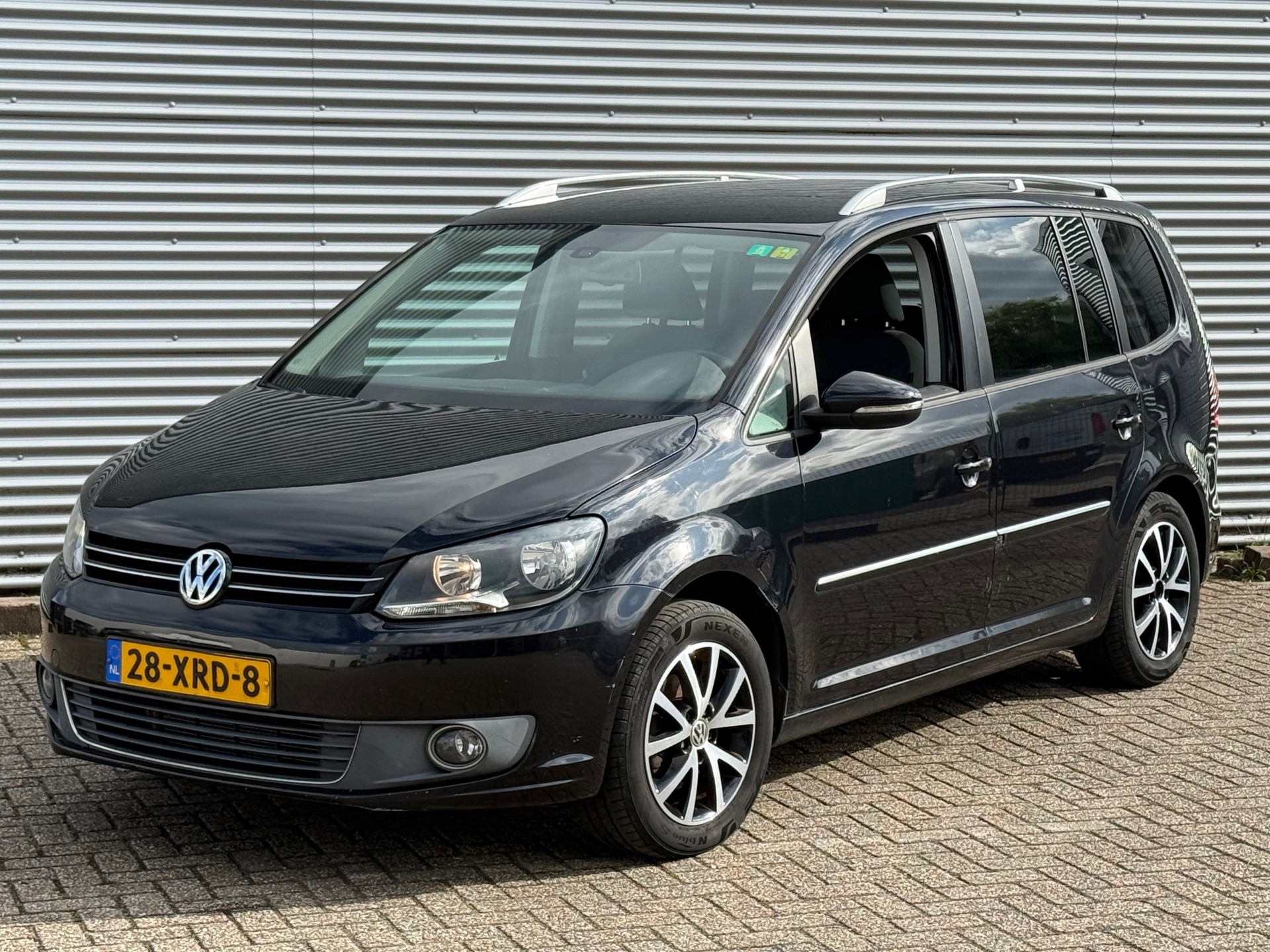 Volkswagen Touran 1.2 TSI Highline BlueMotion / AIRCO / NAP / Inruil Mog. 2012 - voorkant