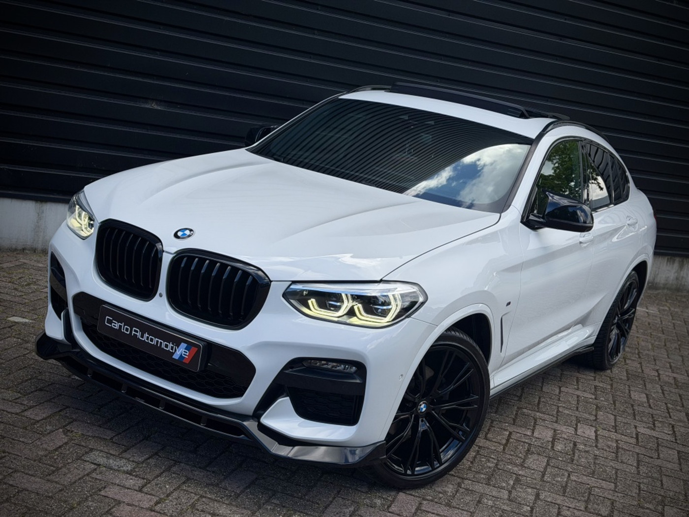 BMW X4 Xdrive20i xDrive20i M-PERFORMANCE PANO|HUD|360|H/K|THAAK 2019 - voorkant