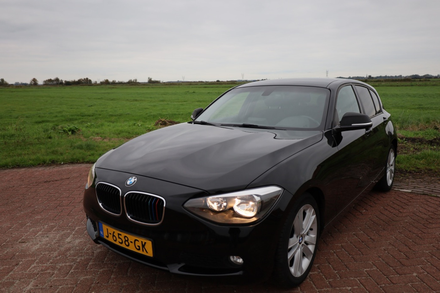 BMW 1er Reihe 116i Business+ 2012 - voorkant