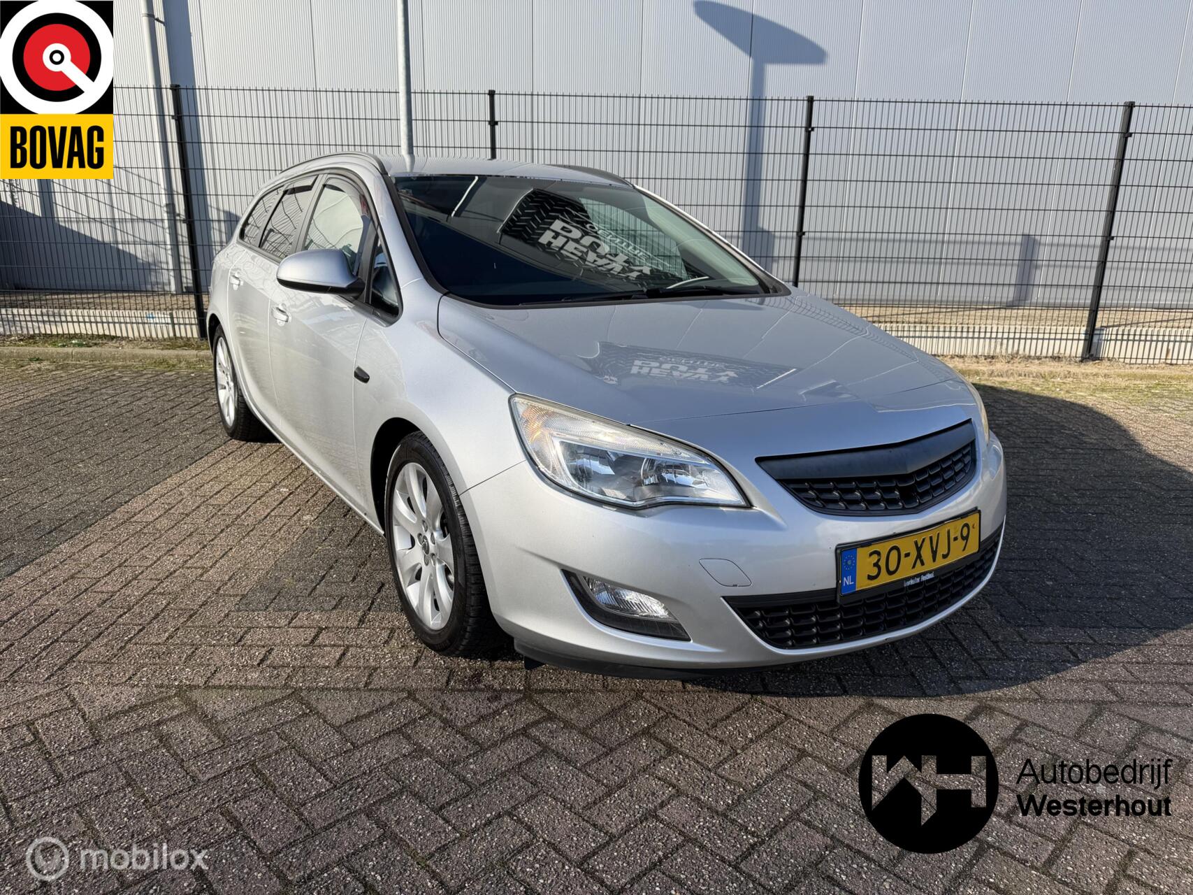 Opel Astra Sports Tourer 1.4 Cosmo Airco Navi Parkeersensoren 2012 - voorkant