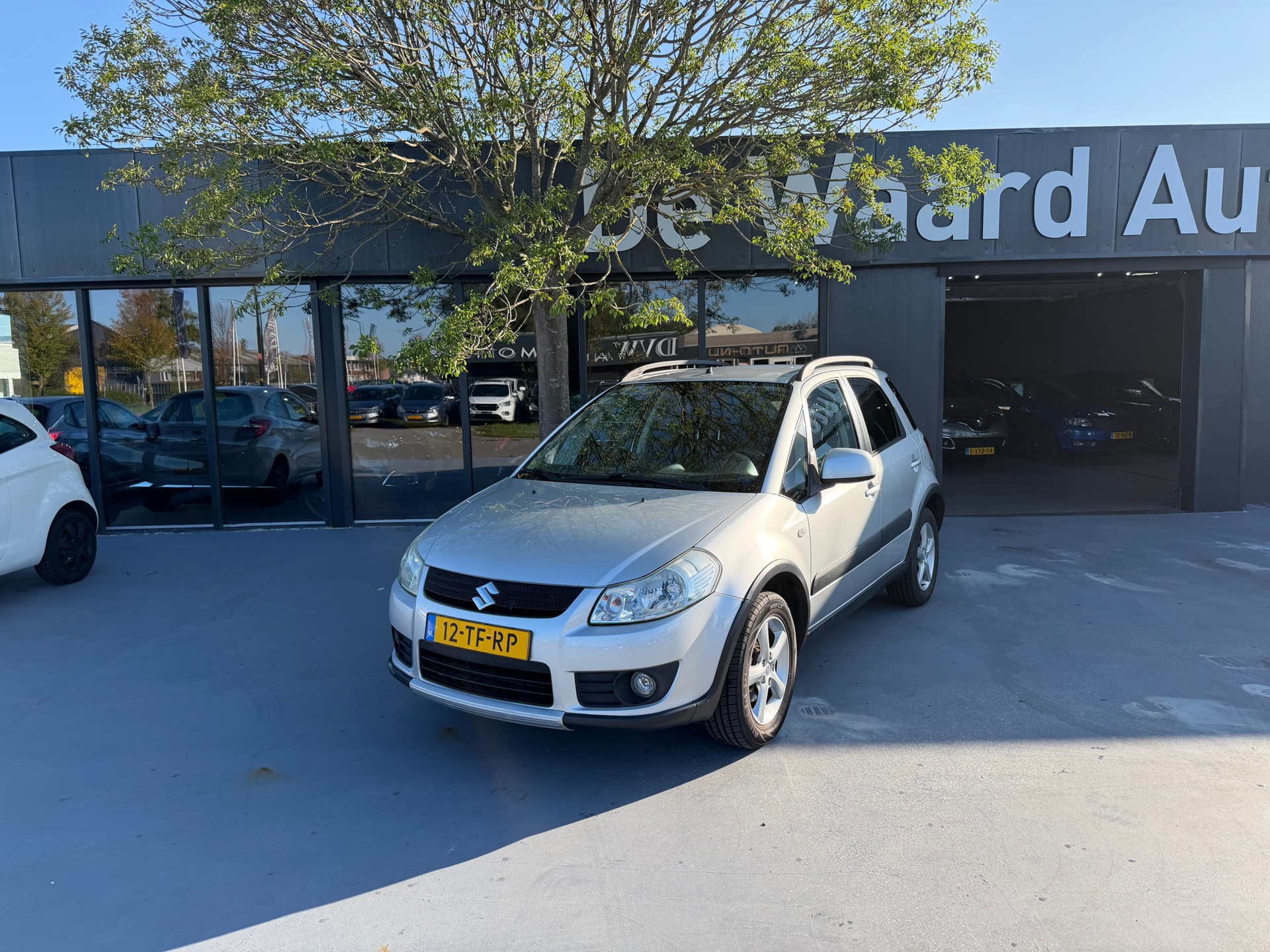 Suzuki Sx4 1.6 4Grip Exclusive/ 4x4/airco/ NAP/1e eigenaar/Goed onderhouden/6 maanden garantie 2006 - voorkant