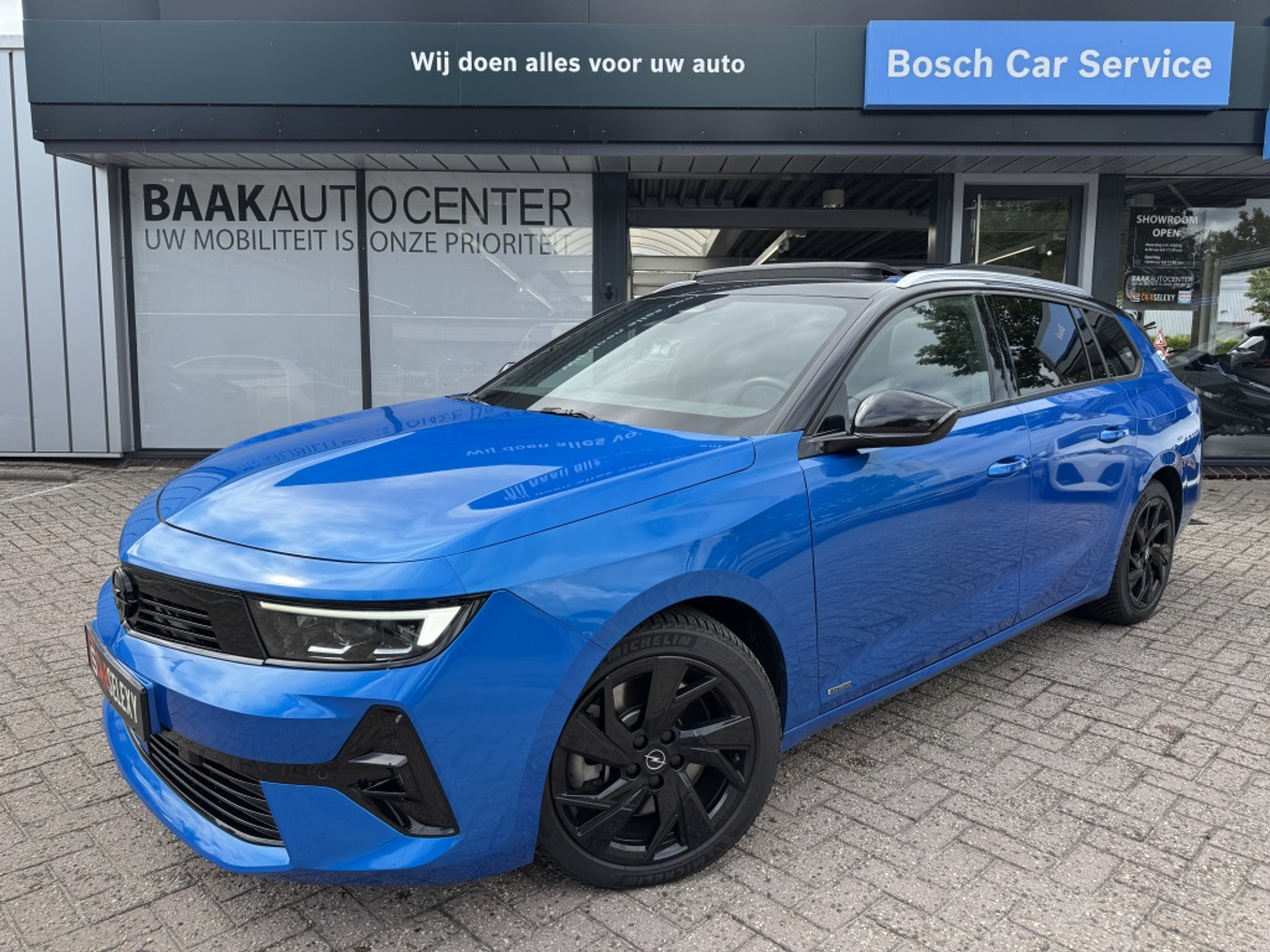 Opel Astra Sports Tourer 1.6 Hybrid Ultimate | Panoramadak | Trekhaak | HUD 2024 - voorkant