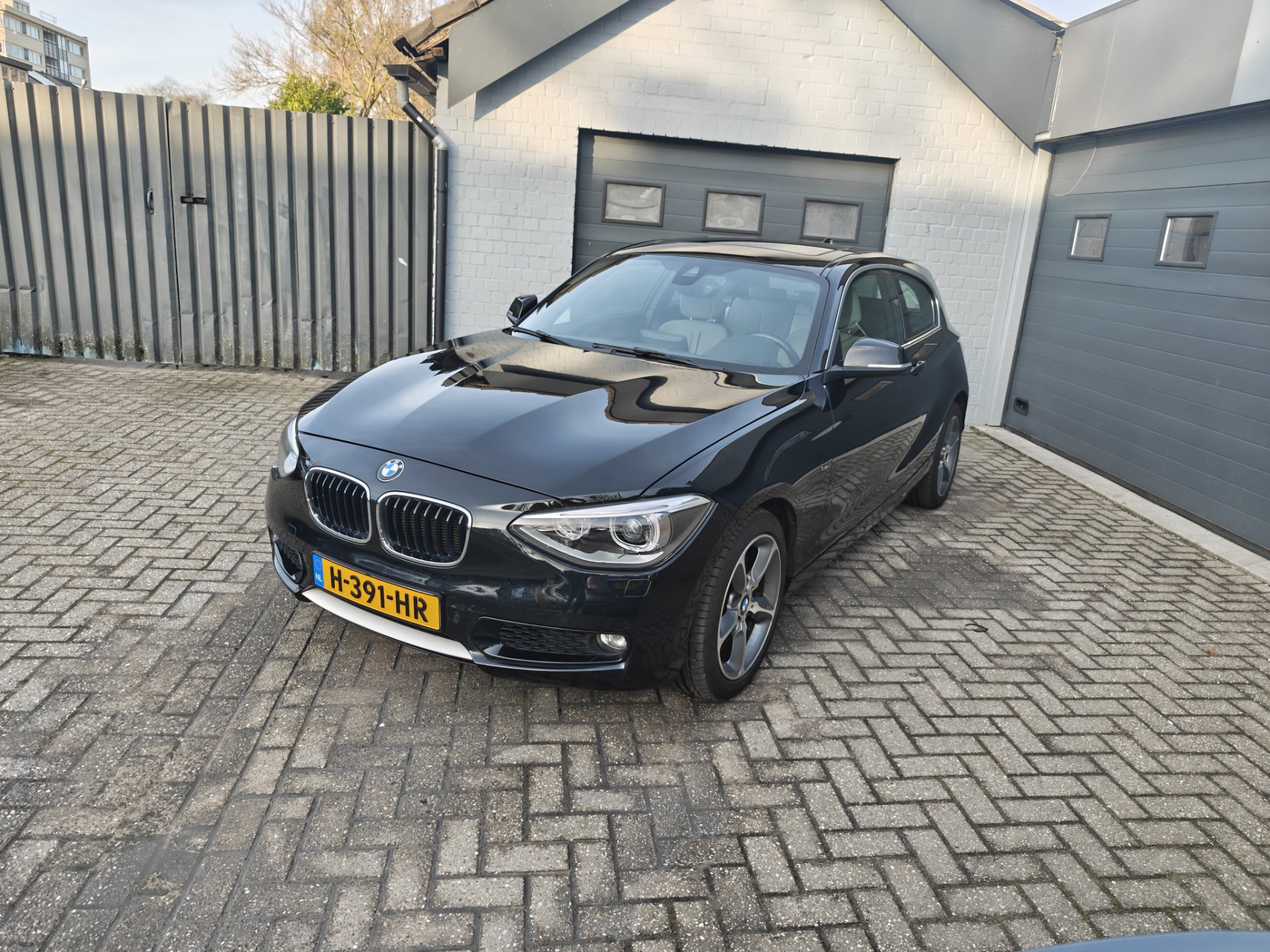 BMW 118i 118i Executive,Parking system,Cruise control,Navi,Climate control,Schuifkantel dak 2013 - voorkant