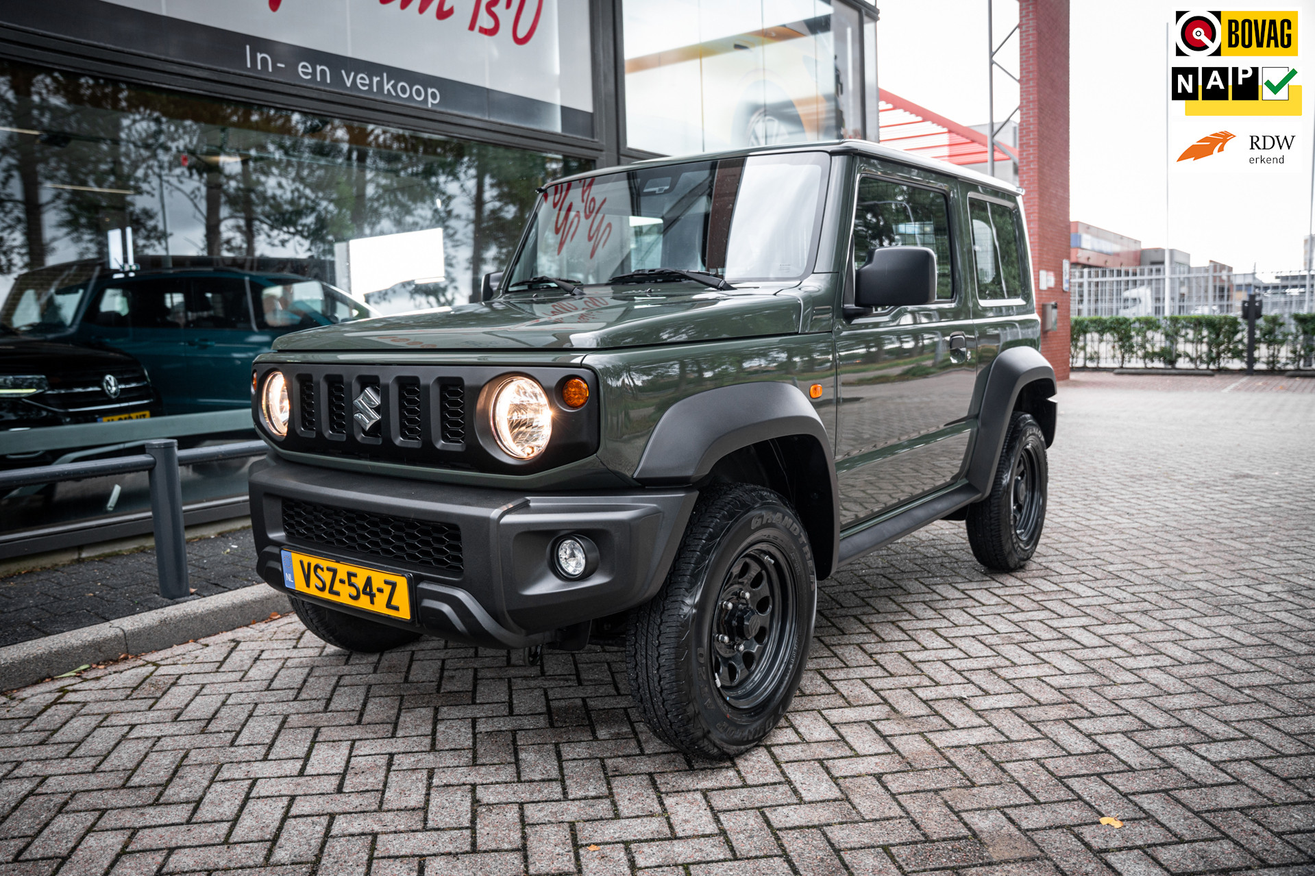 Suzuki Jimny 1.4 4wd | Airco | Cruise | Lane departure warning | Grijs kent | Trekhaak 2023 - voorkant