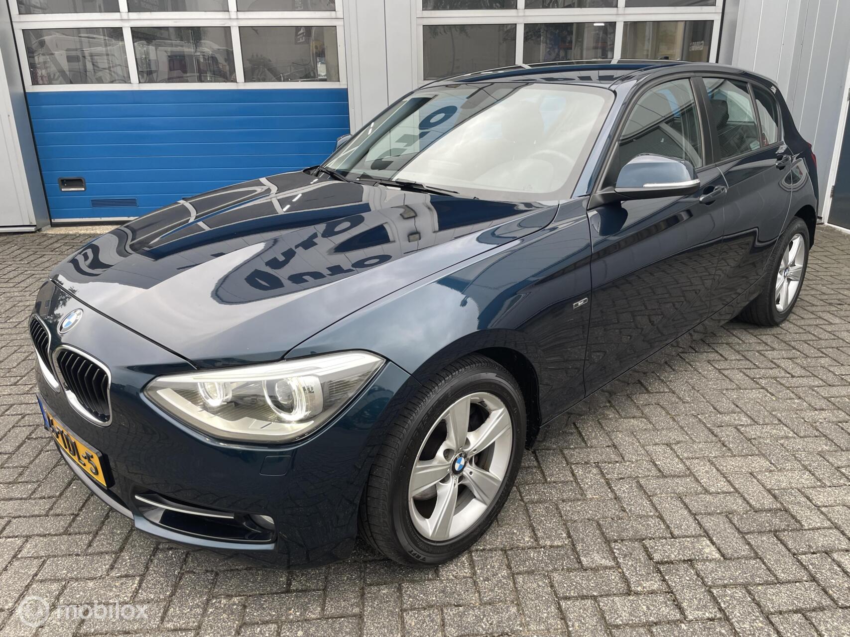 BMW 1er Reihe 118i 170Pk Automaat Sport Line Trekhaak-Cruise 2012 - voorkant