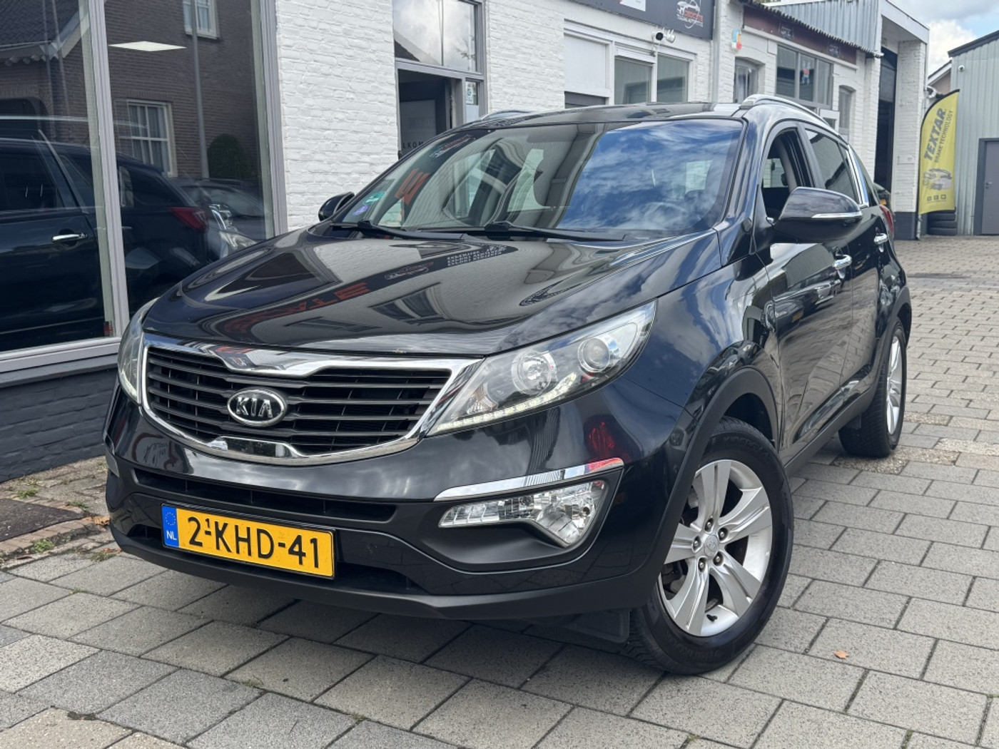 Kia Sportage 1.6 GDI Plus Pack*Navi*Tr-haak*Camera*Dealer-ond.* 2013 - voorkant