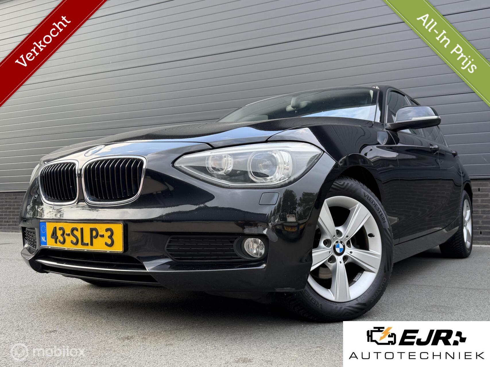BMW 1er Reihe 116i Business AIRCO*CRUISE*NAV*ACC*NAP*NW APK 2011 - voorkant