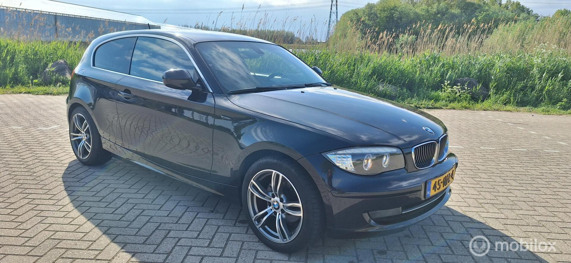 BMW 1er Reihe 118i High Executive 2010 - voorkant