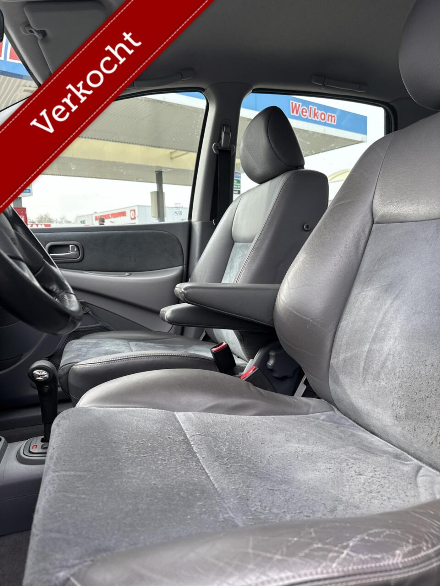 Foto van Nissan Almera Tino