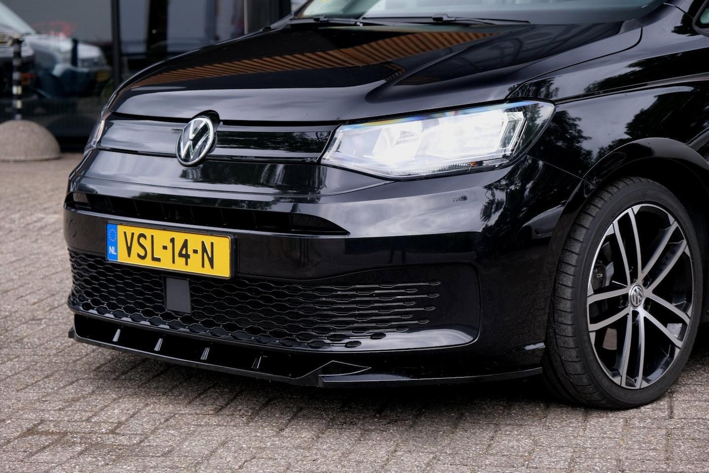 Foto van Volkswagen Caddy Modified Partition Wall