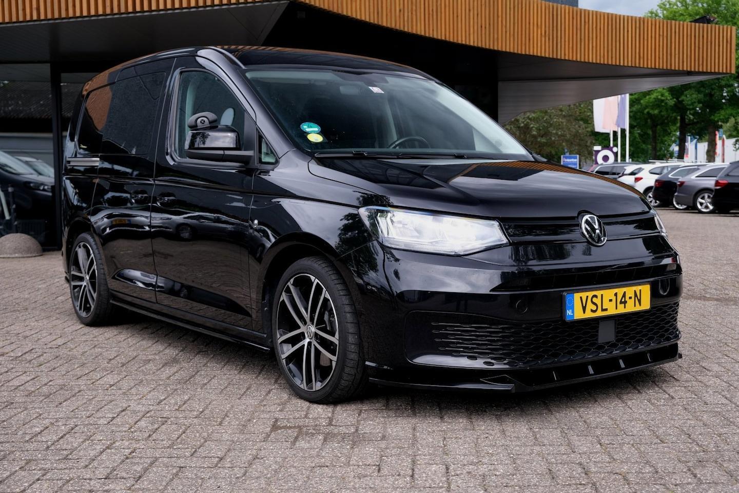 Foto van Volkswagen Caddy Modified Partition Wall