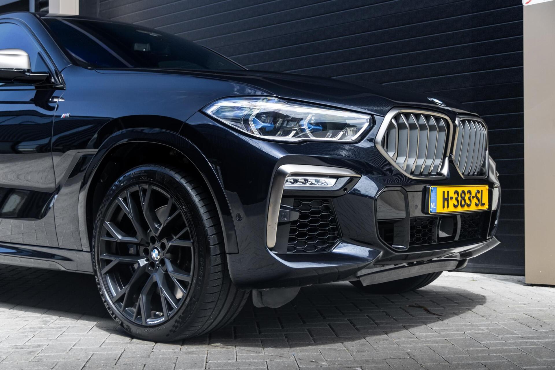 Foto van BMW X6 M50d