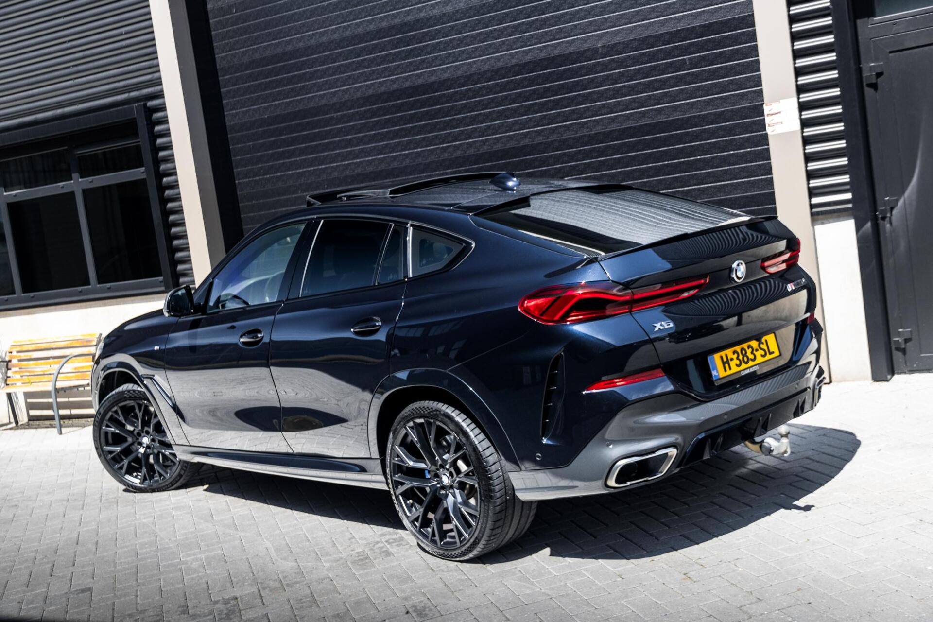 Foto van BMW X6 M50d