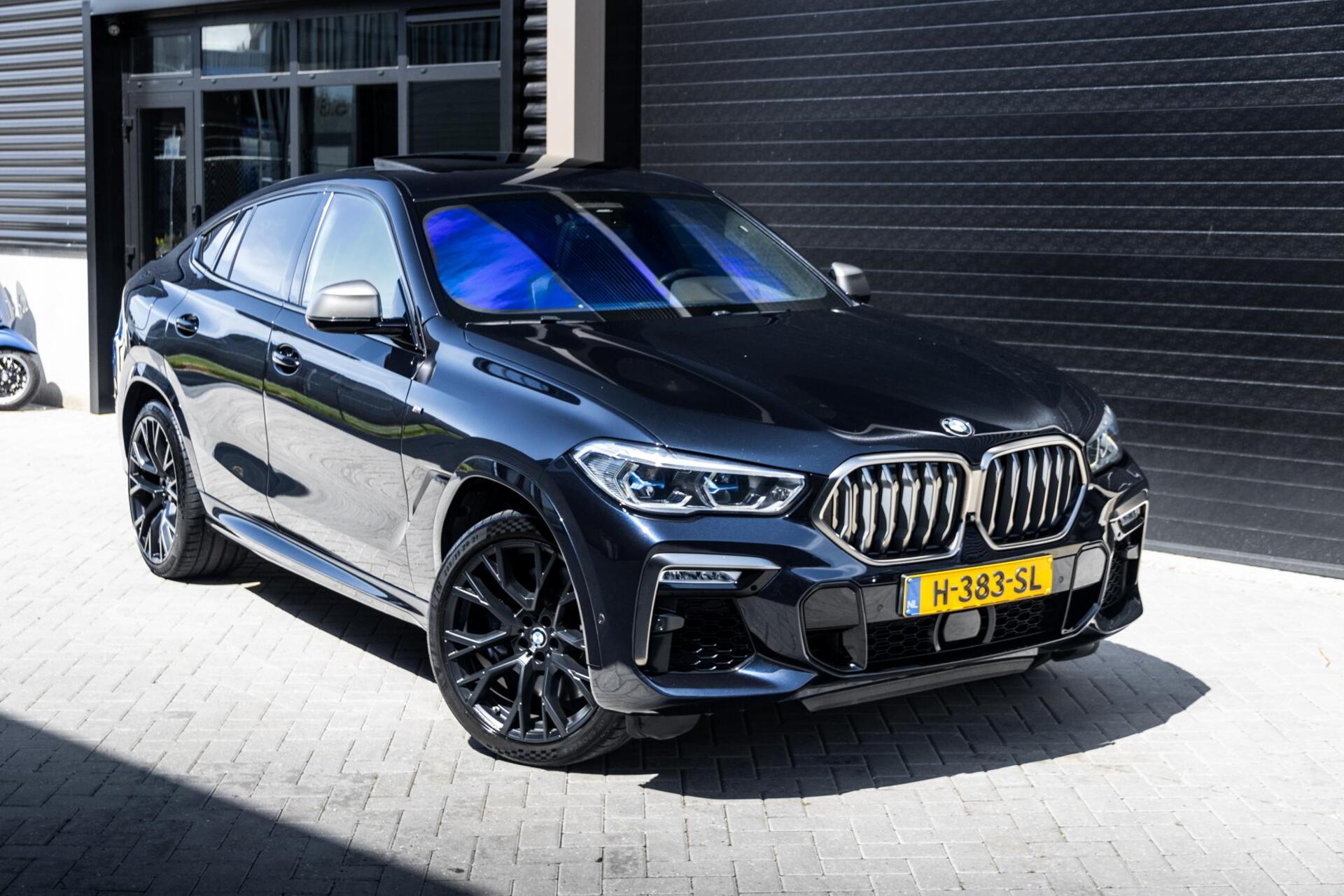 Foto van BMW X6 M50d