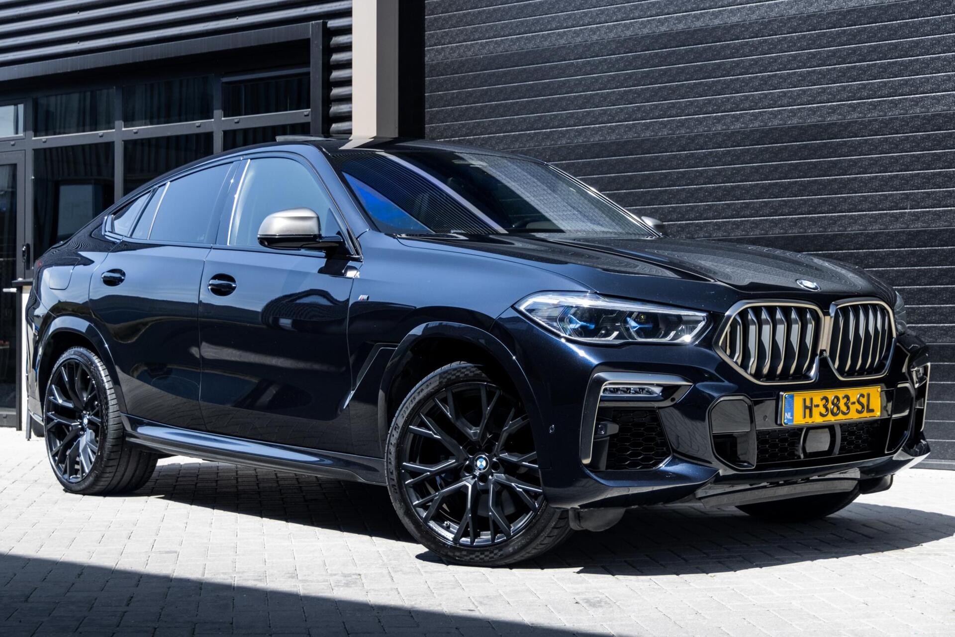 Foto van BMW X6 M50d