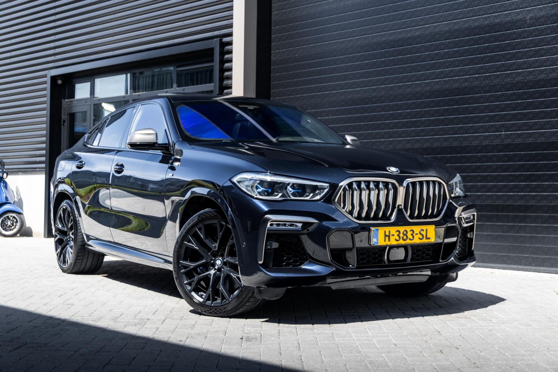 Foto van BMW X6 M50d