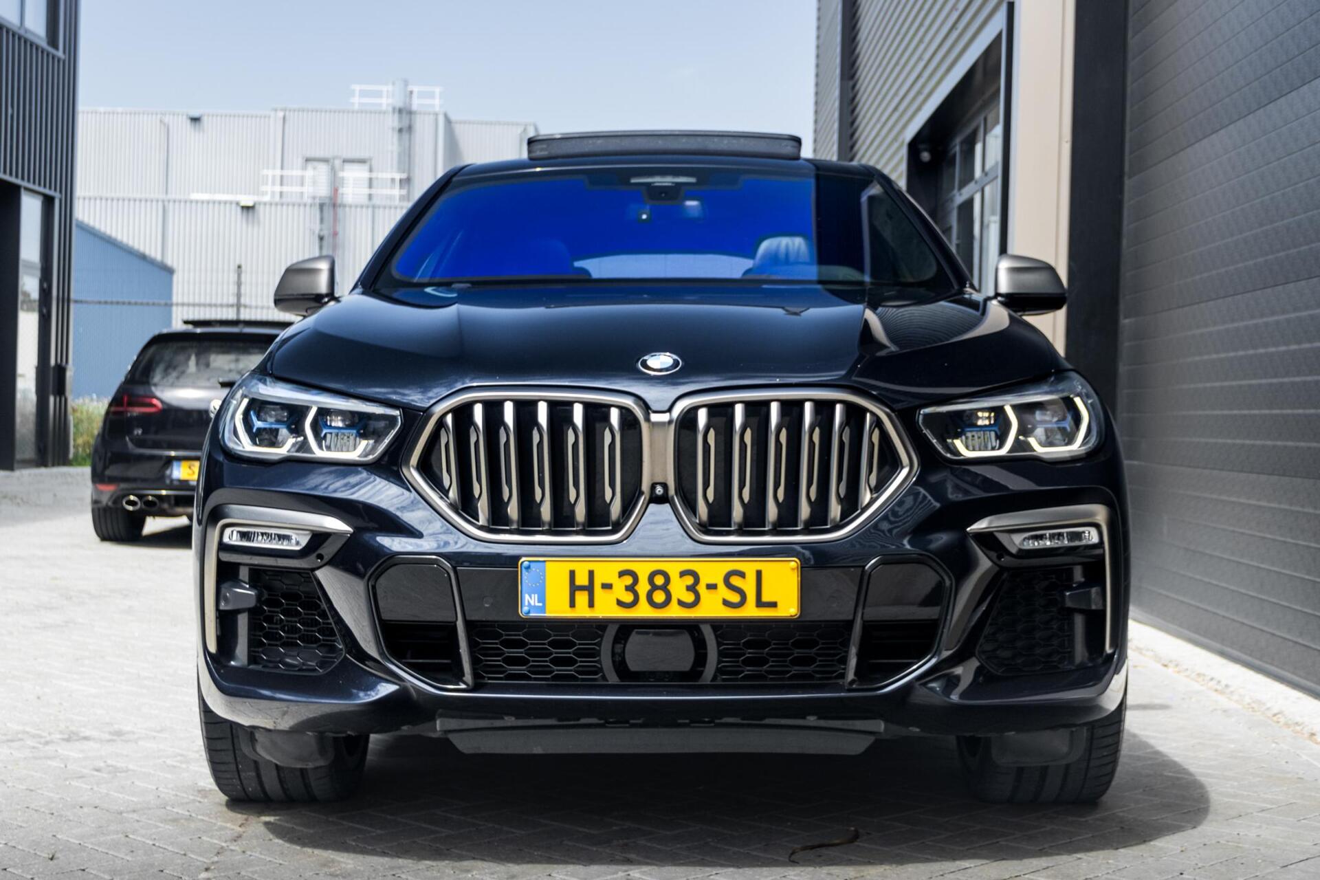 Foto van BMW X6 M50d