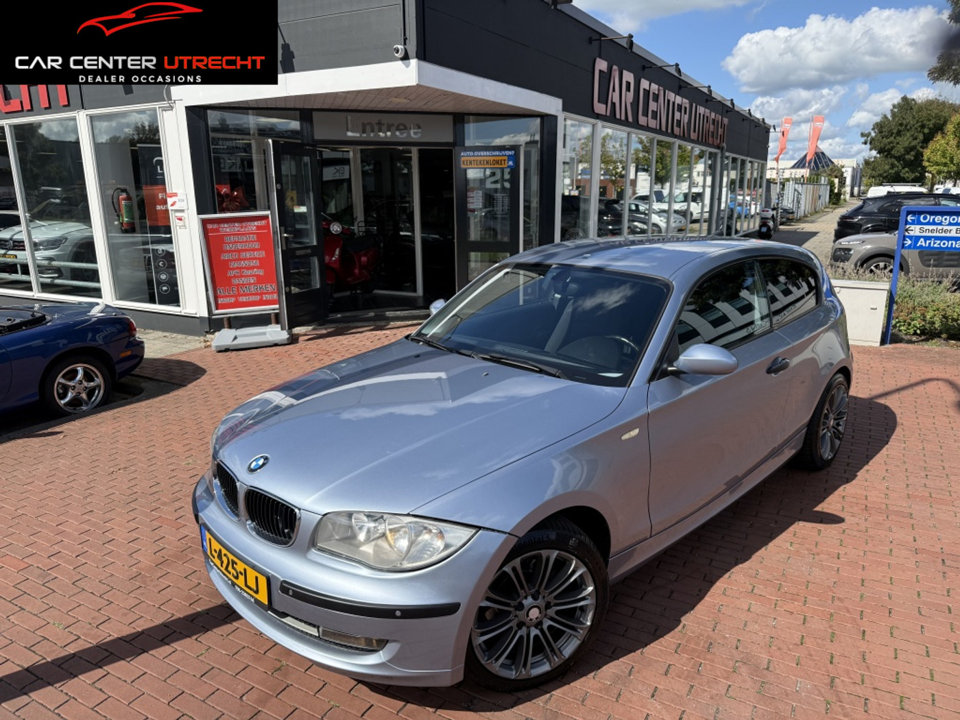 BMW 1er Reihe 116i 2009 - voorkant
