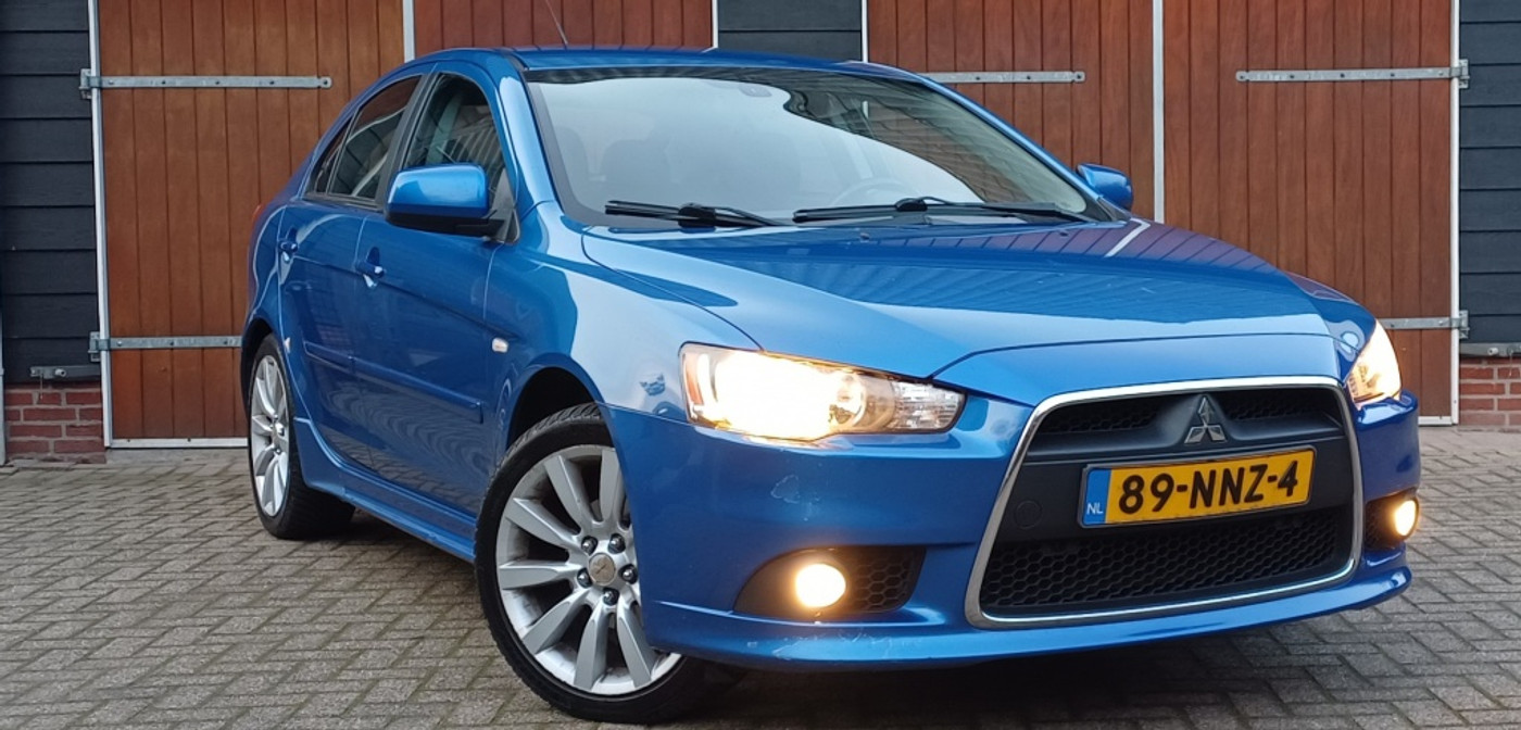 Mitsubishi Mitsubishi Lancer 1.8 Intense | Bluetooth | Trekhaak | NAP | Parkeersensoren | All seasonbanden 2010 - voorkant