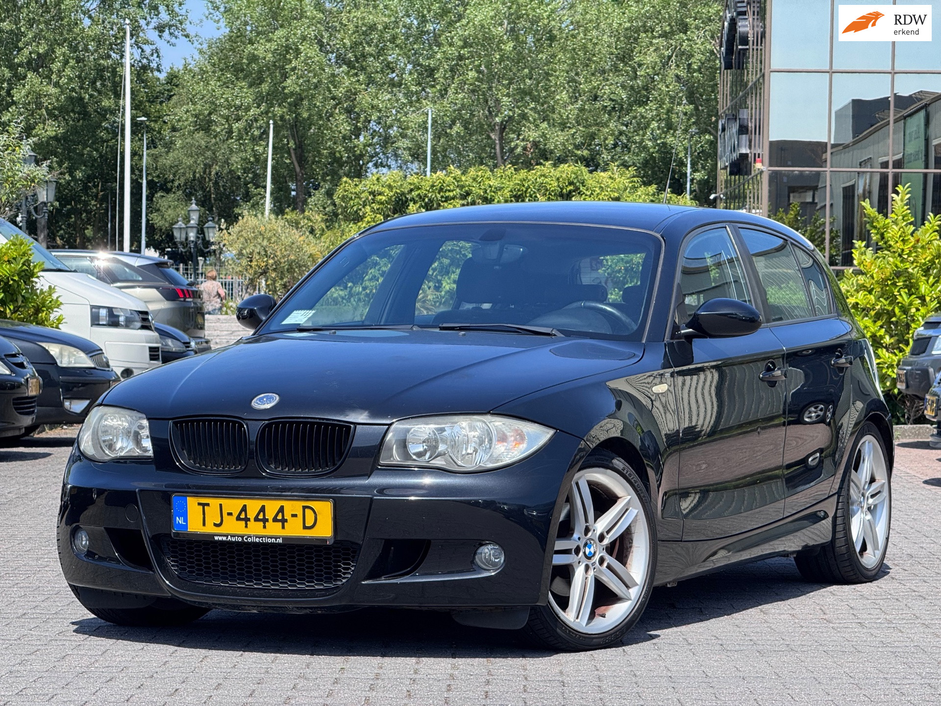 BMW 1er Reihe 116i M-Performance | Leder sportstoelen | 18 inch | Airco | Elektrische spiegels | Stoelverwarming | 2008 - voorkant