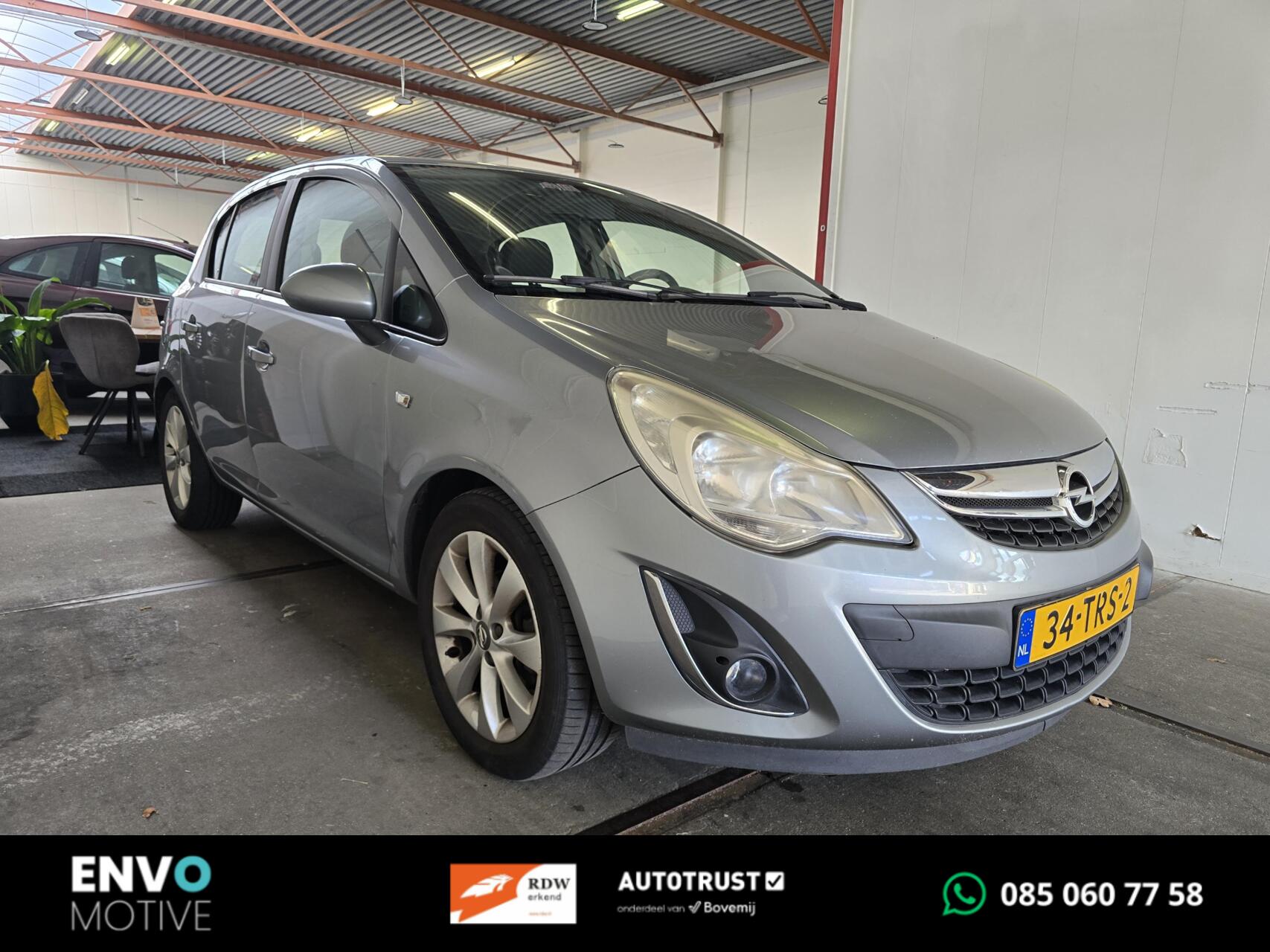 Opel Corsa 1.4-16V Airco/Cruise/Half-leer/Trekhaak/LMV 2012 - voorkant