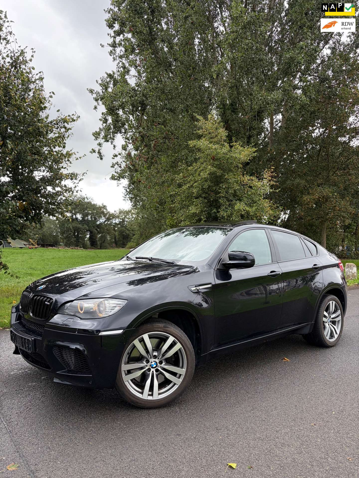 BMW X6 M 4.4i M|NAP|555PK|Full Option! Carbon zwart 2010 - voorkant