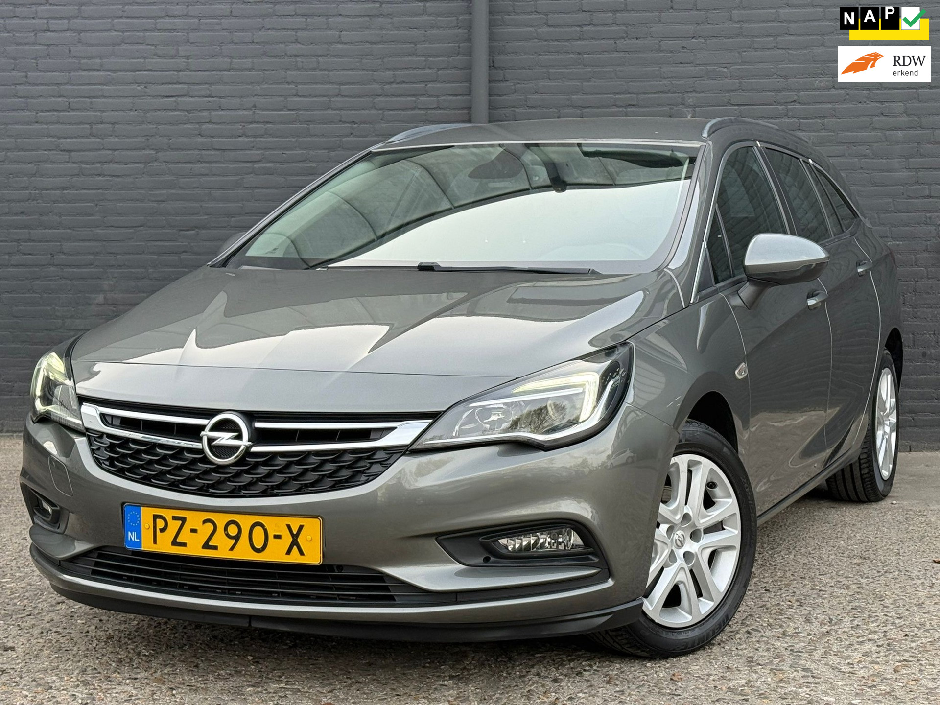 Opel Astra Sports Tourer 1.0 Business+ NAVI | PDC | TREKHAAK  | AIRCO | NWE APK 2017 - voorkant