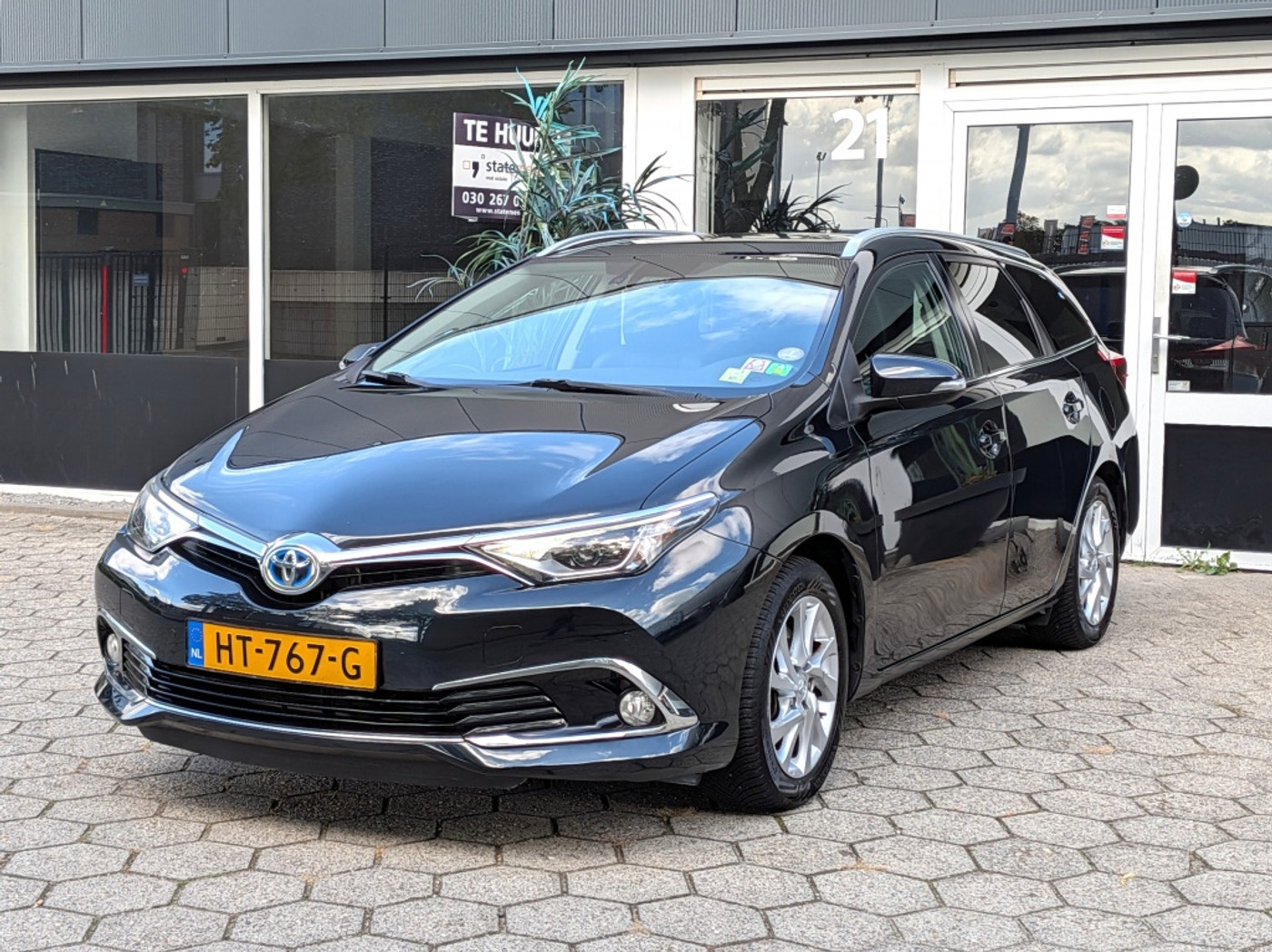 Toyota Toyota Auris 1.8 Hybrid Lease Pro NAVI CLIMA KEYLESS CAMERA 2015 - voorkant