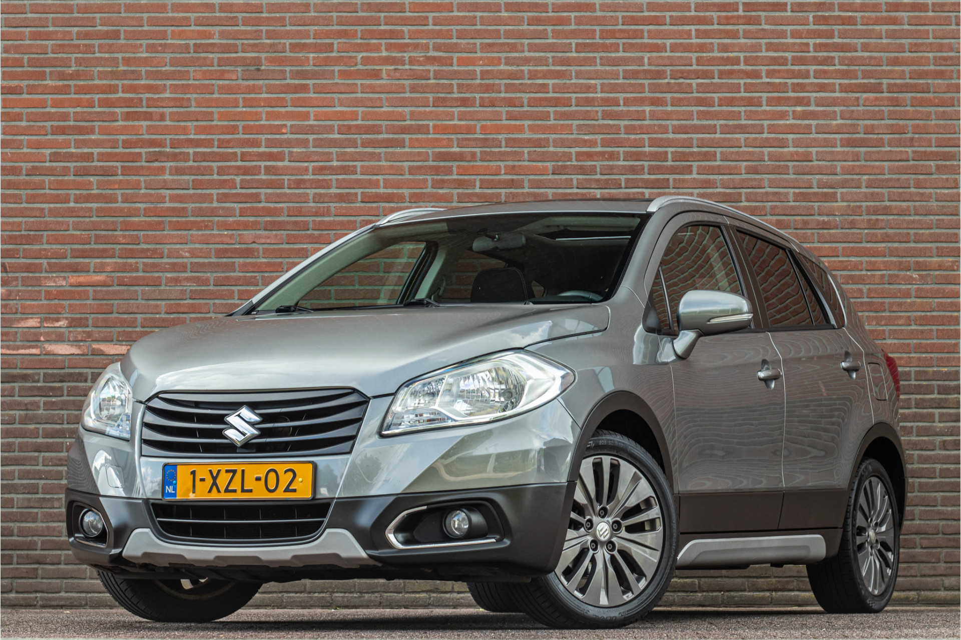 Suzuki Sx4 1.6 Exclusive, 2e eigenaar, 128.000km, Panoramadak, Navigatie, Stoelverwarming, PDC, Bluetooth. 2014 - voorkant