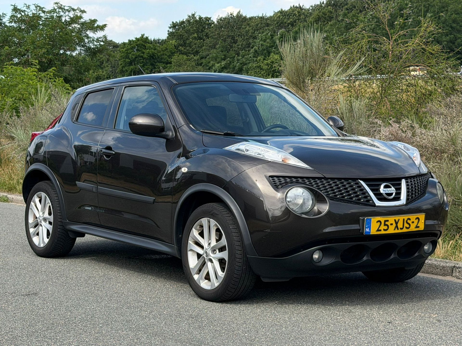 Nissan Nissan Juke 1.6 Acenta NWE APK / AIRCO / NAVI / CAMERA / PDC / TREKHAAK / CRUISE / 2012 - voorkant