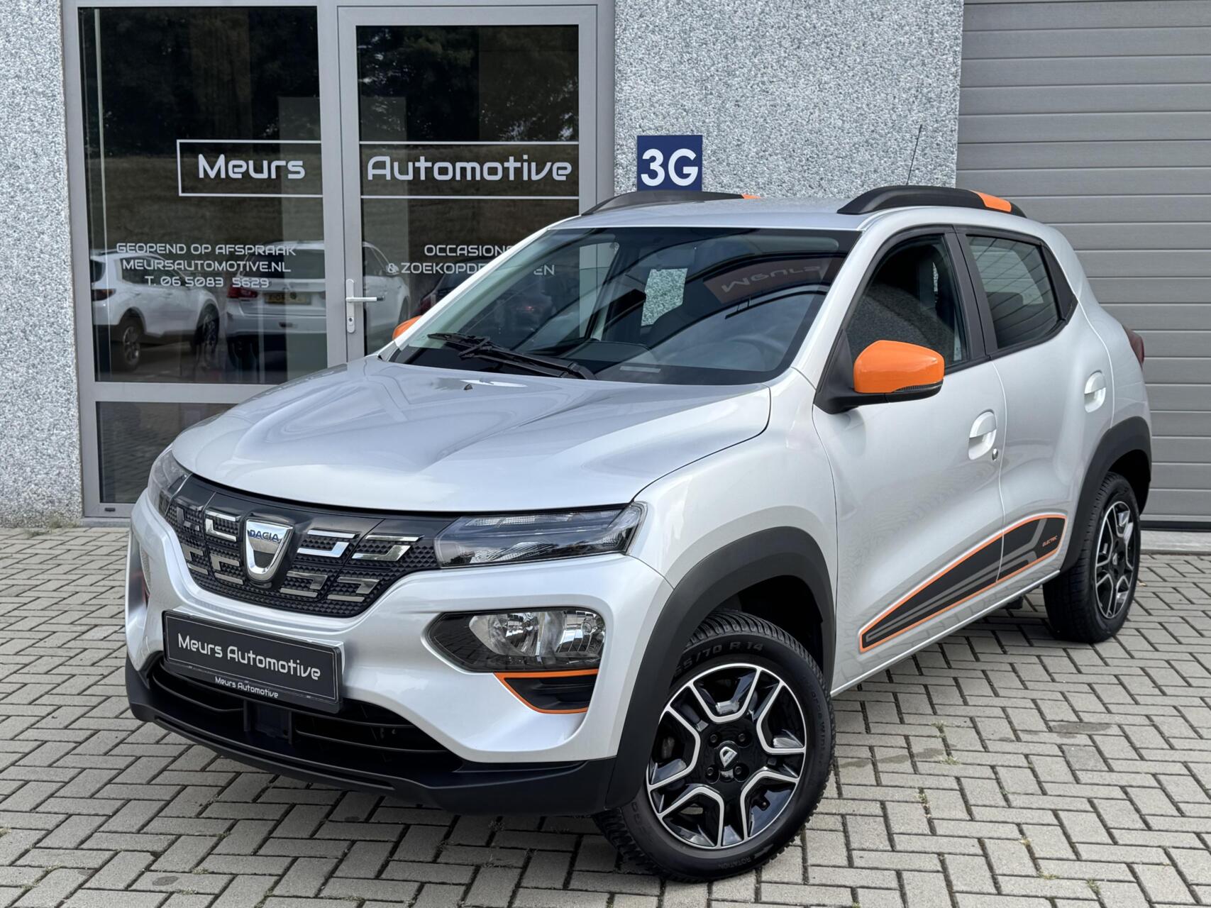 Dacia Spring Comfort Plus (Orange Pack) SOH 93% 27 kWh/Navi/Camera/CarPlay 2022 - voorkant