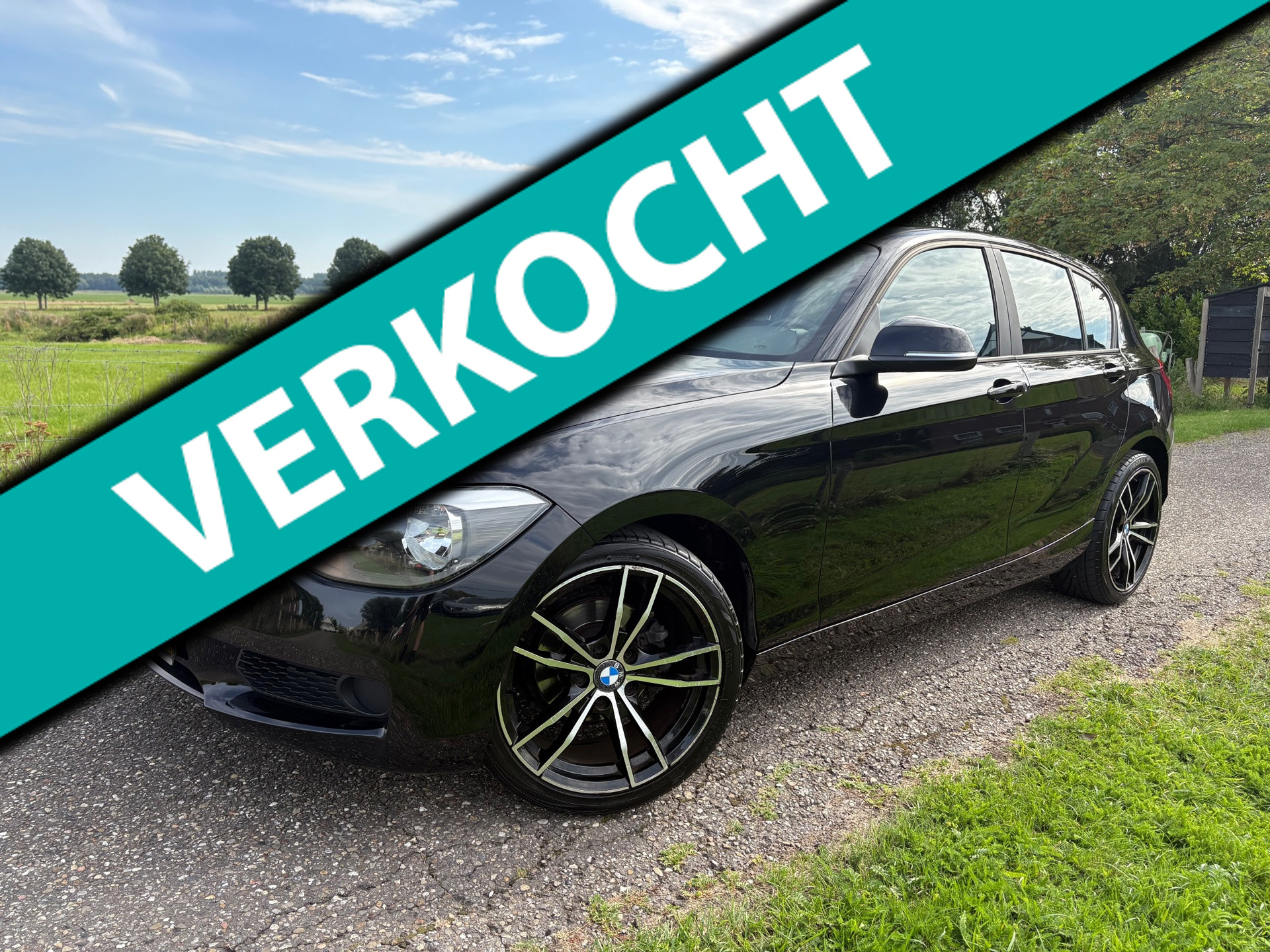 BMW 114i 114i EDE High Executive|Stoelverw|ParkSensor|Climate|2014| Zwart 2014 - voorkant