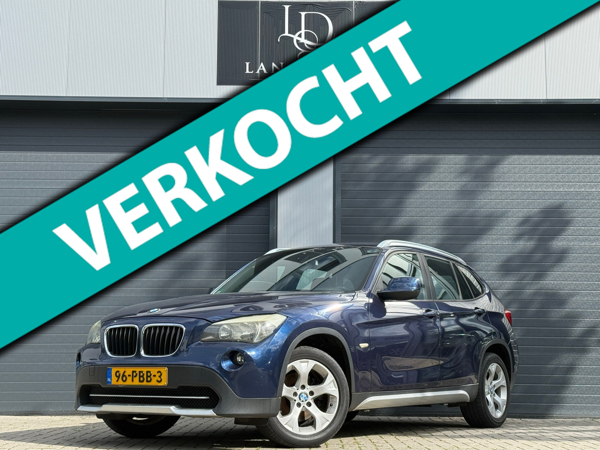 BMW X1 SDrive18i Executive / LAGE KM / PDC / AIRCO / NAVI 2011 - voorkant