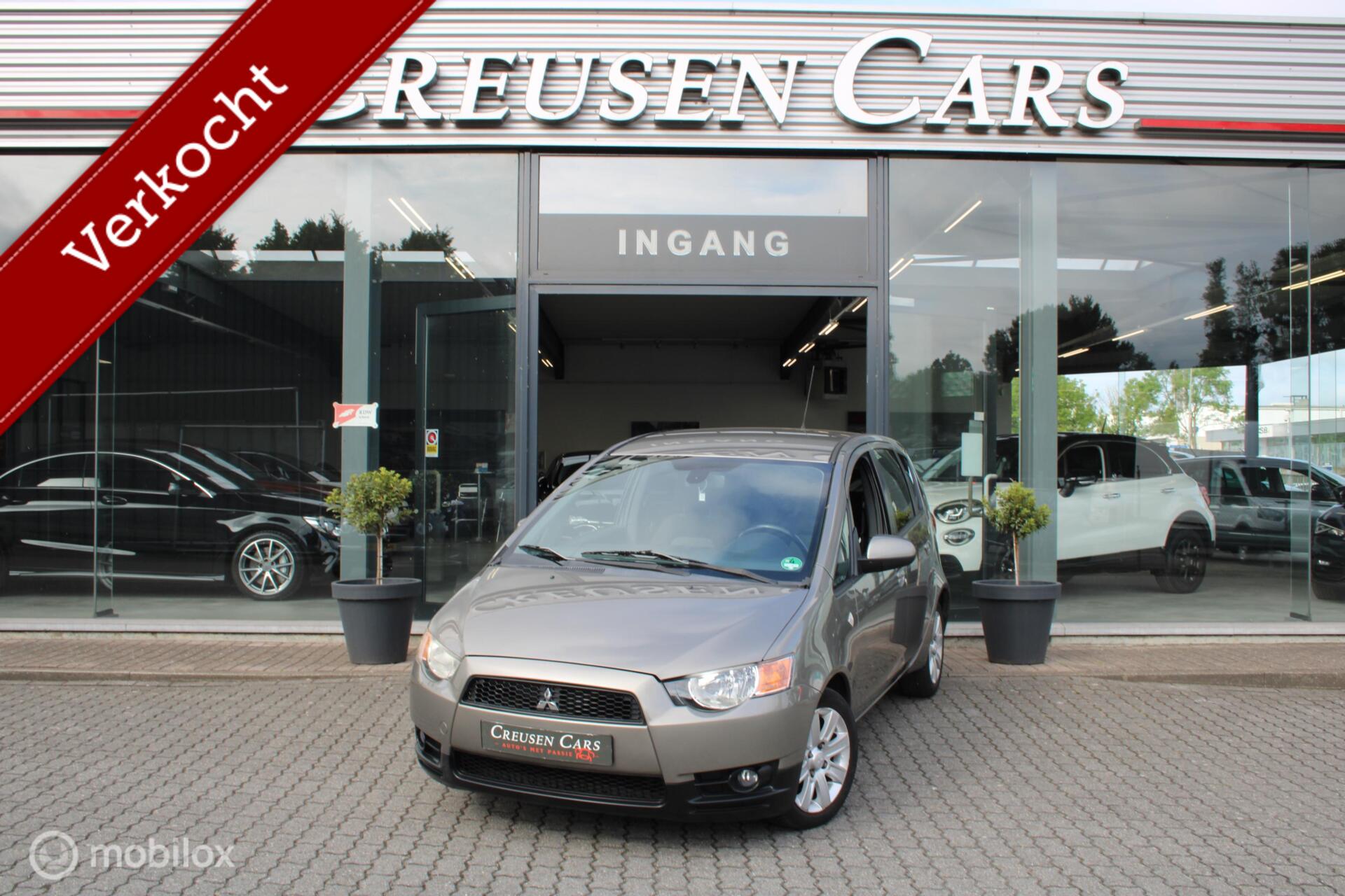 Mitsubishi Colt 1.3 Edition Two/Airco/Trekhaak/All season/ 2010 - voorkant