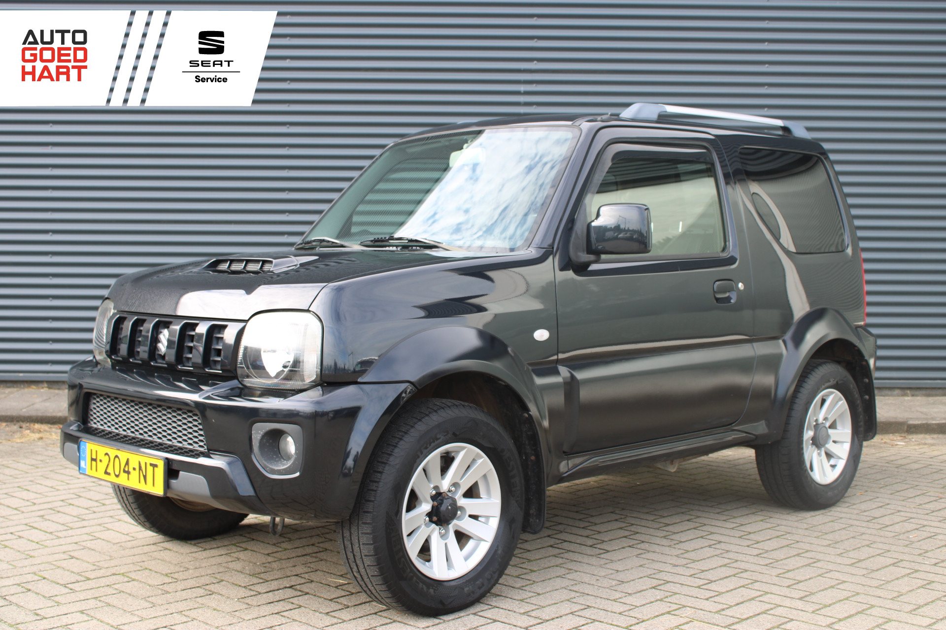 Suzuki Jimny 1.3 Exclusive 4x4 Vol-Leder Stoelverwarming Airco Trekhaak 2013 - voorkant