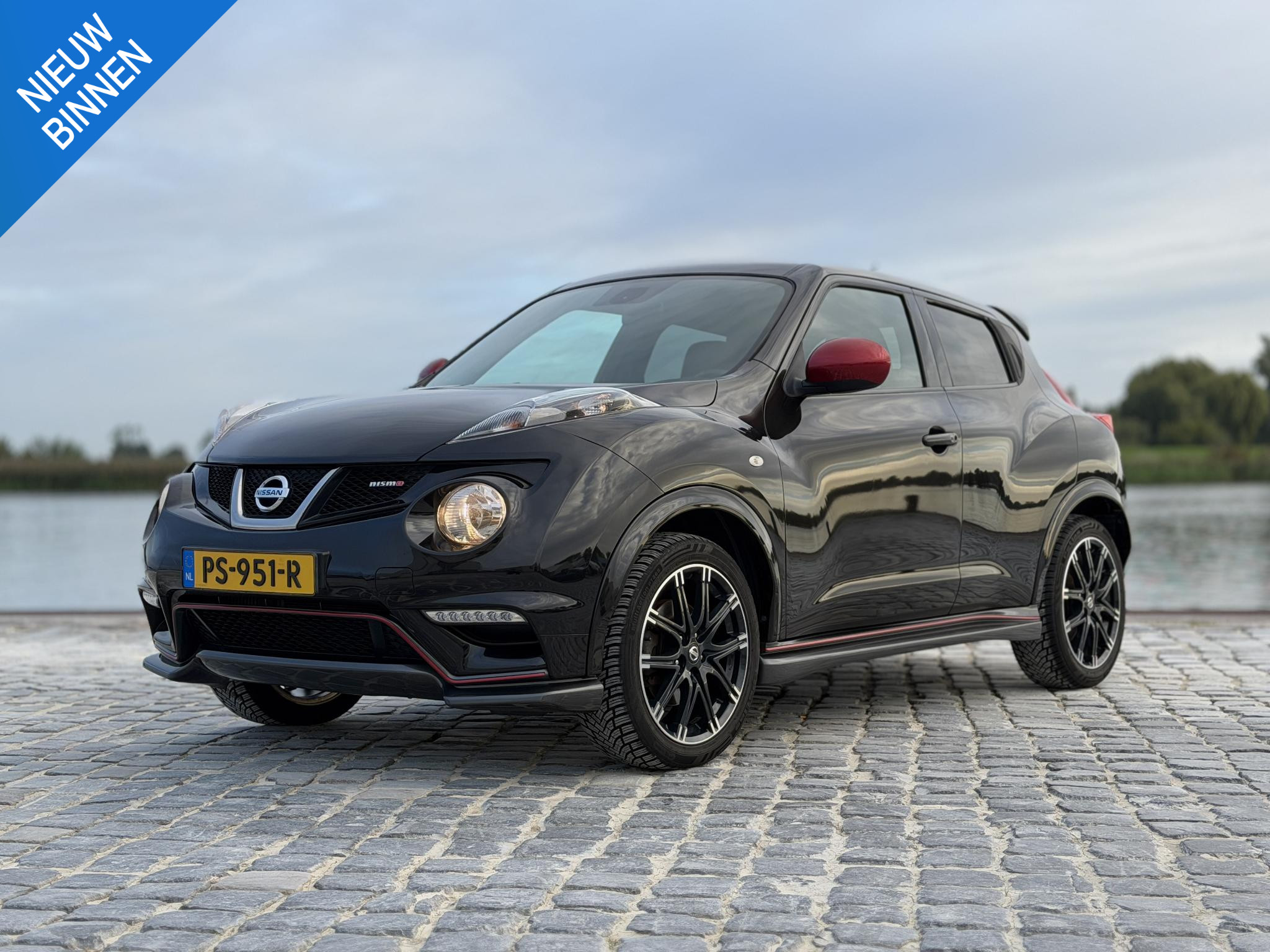 Nissan Nissan Juke 1.6 Turbo NISMO 200 PK|Carplay,Camera,Stoel vw. 2013 - voorkant