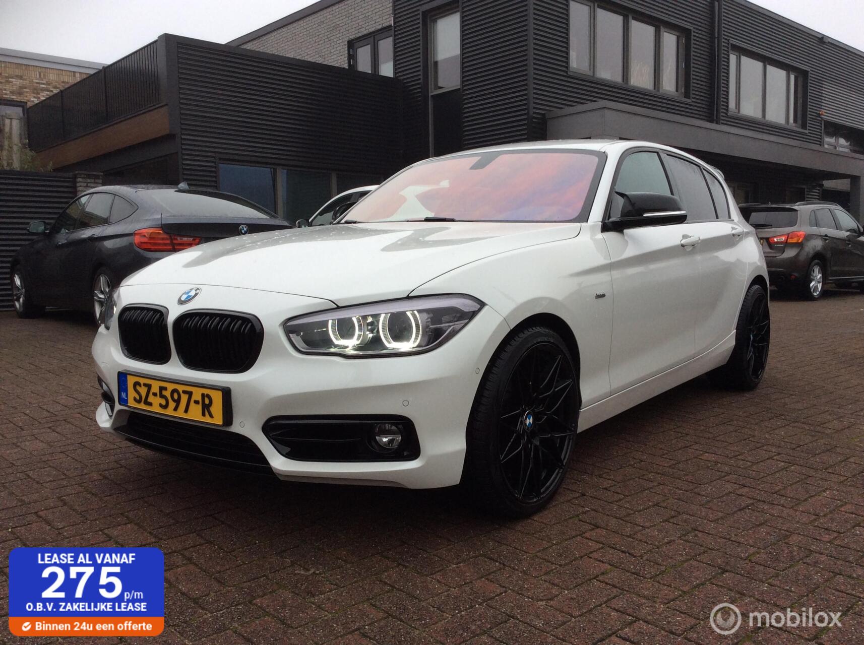 BMW 1-serie 118d Executive 19"lm vlg Nav Apple Carplay nap leder 2018 - voorkant