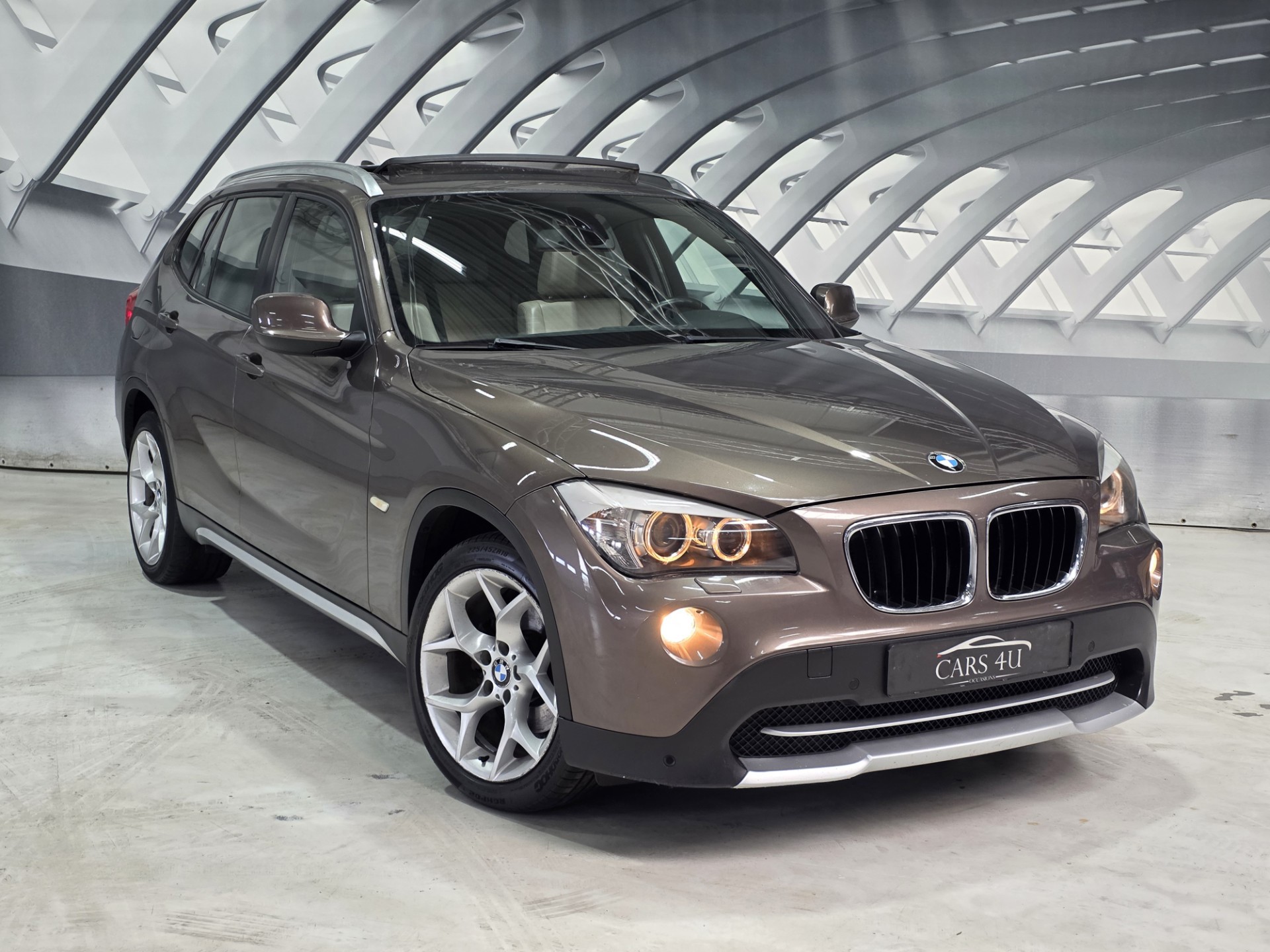 BMW X1 sDrive 18i SDrive18i Executive pano zw hemel leer 2010 - voorkant
