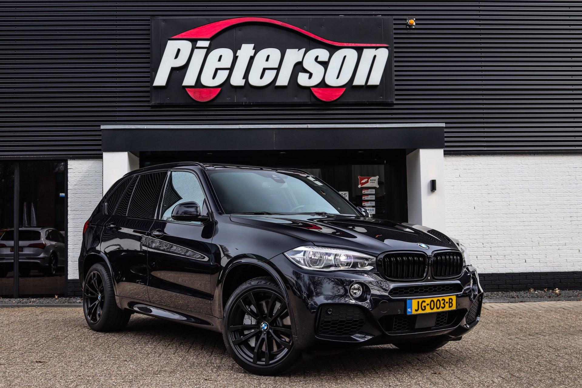 BMW X5 Xdrive50i XDrive50i 7p M-Pakket PANO MEMORY ACC H&K LEDER XENON 2014 - voorkant