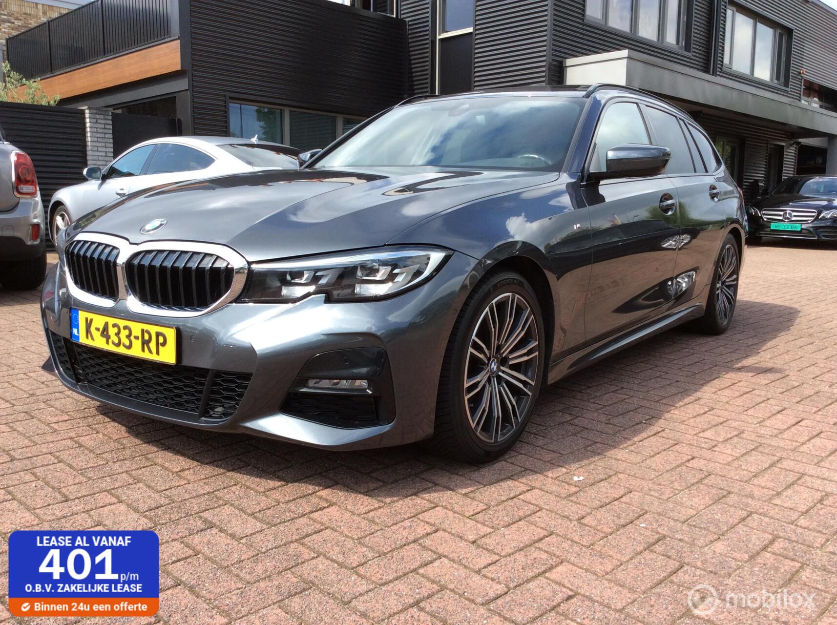 BMW 3-serie Touring 320i High Executive M-Pakket Panorama dak 2021 - voorkant