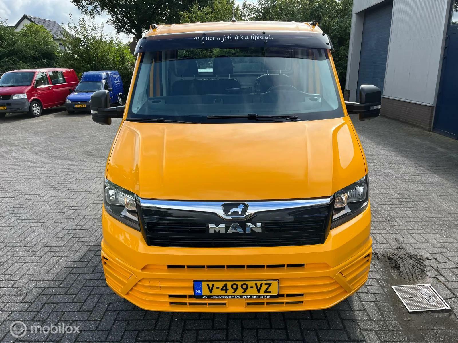 Foto van Man Tge