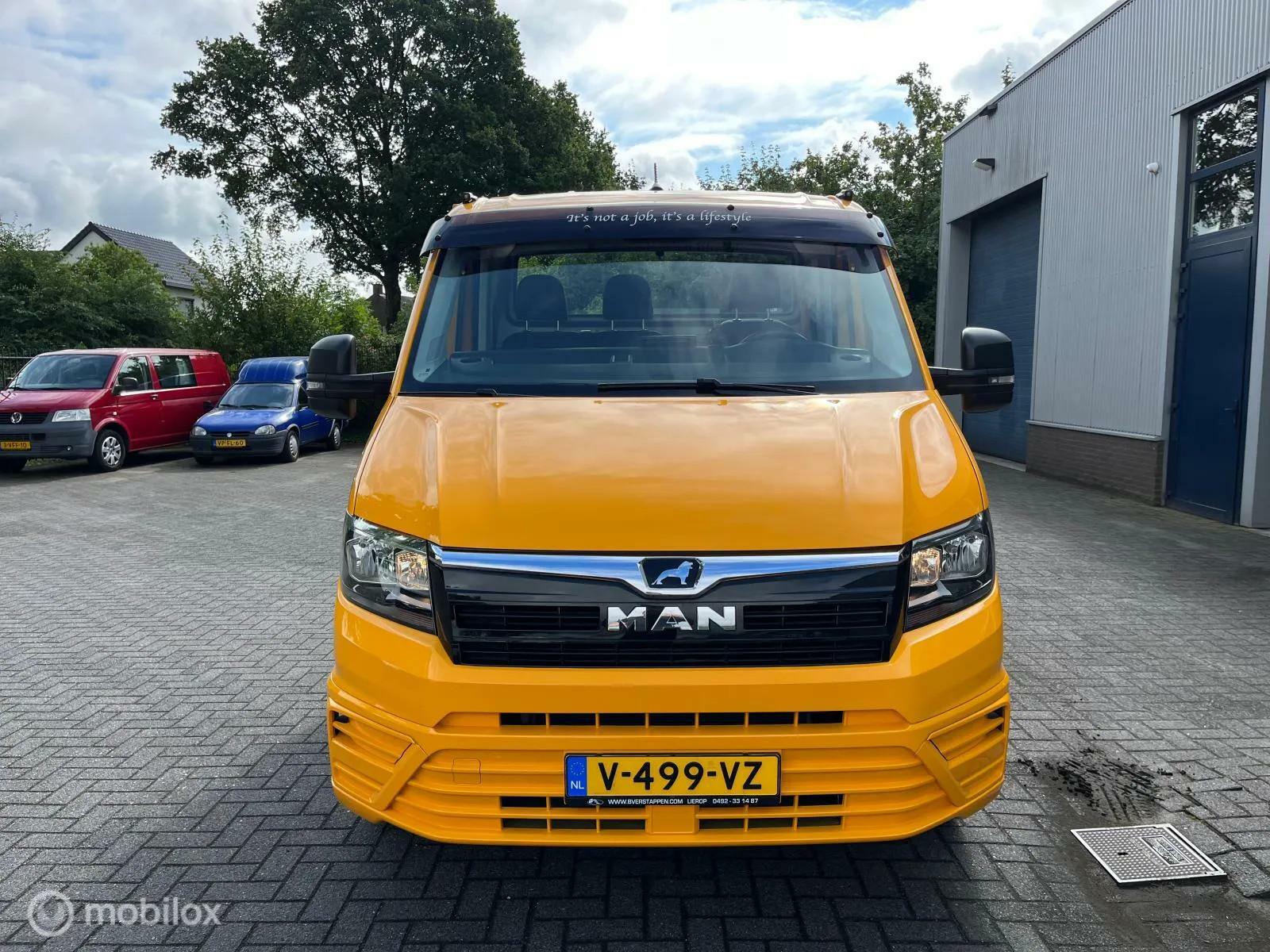 Foto van Man Tge