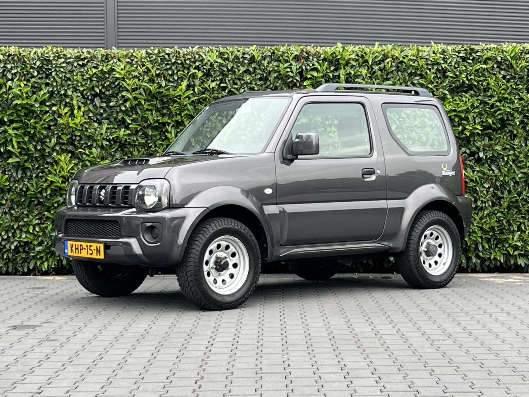 Suzuki Jimny 1.3 Exclusive RANGER, AUTOMAAT, AIRCO, STOELVERWARMING, TREKHAAK, ELEKTRISCHE RAMEN, DAK RAILS 2017 - voorkant