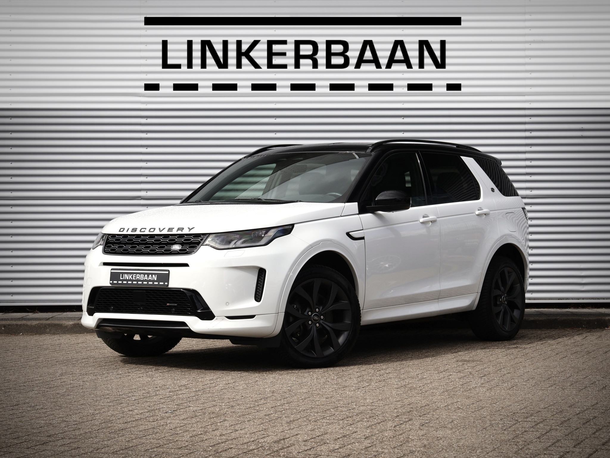 Land Rover Discovery Sport P300e 1.5 R-Dynamic SE | SOH 92% | Black Pack | Cold Climate | Leder | ACC | Camera | 20 inch | 2023 - voorkant