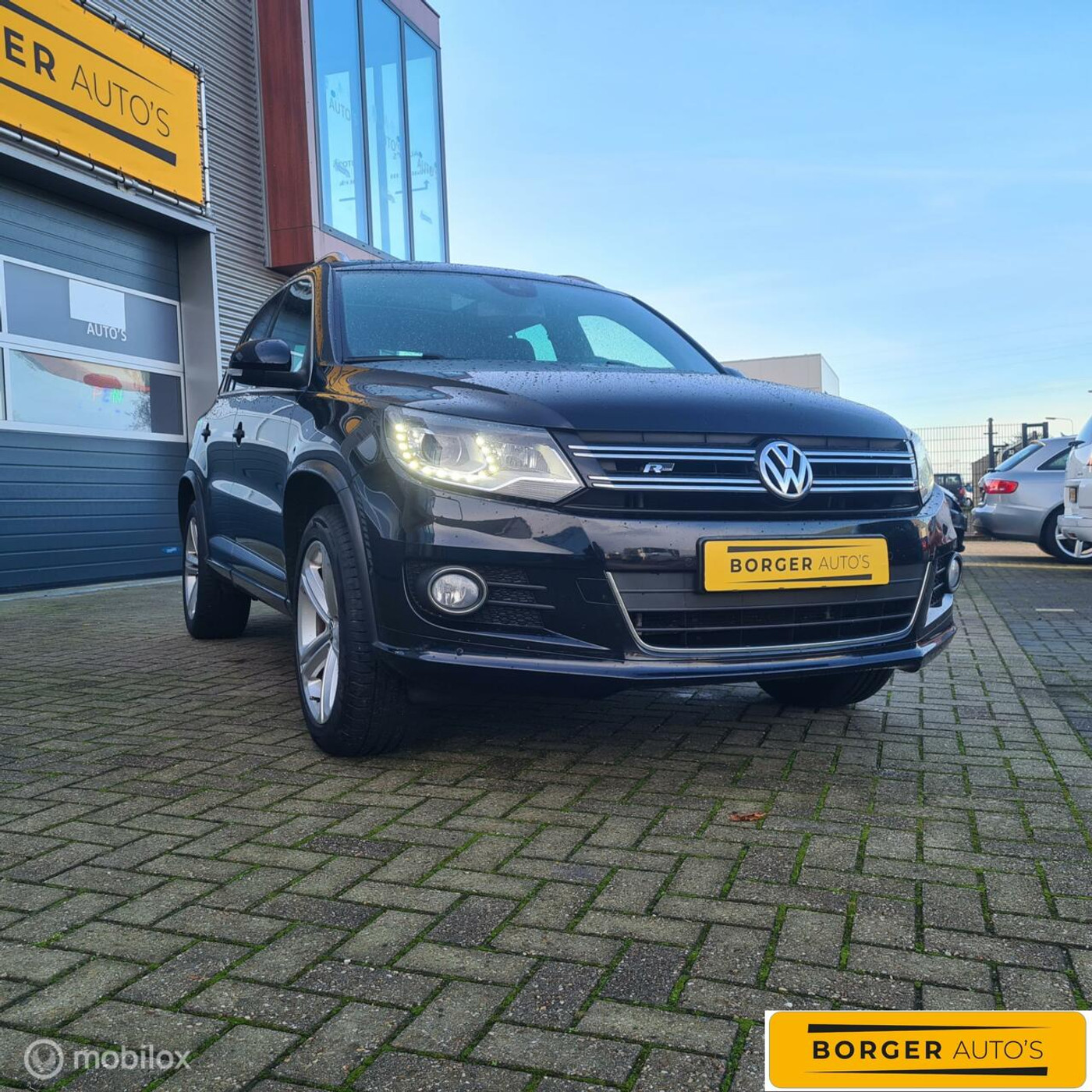 Volkswagen Tiguan 1.4 TSI Sport&Style R-Line|100% onderhouden|Pano|Camera|Trekhaak|Navi|Lane Assist|Verkeersbordherkenning 2012 - voorkant