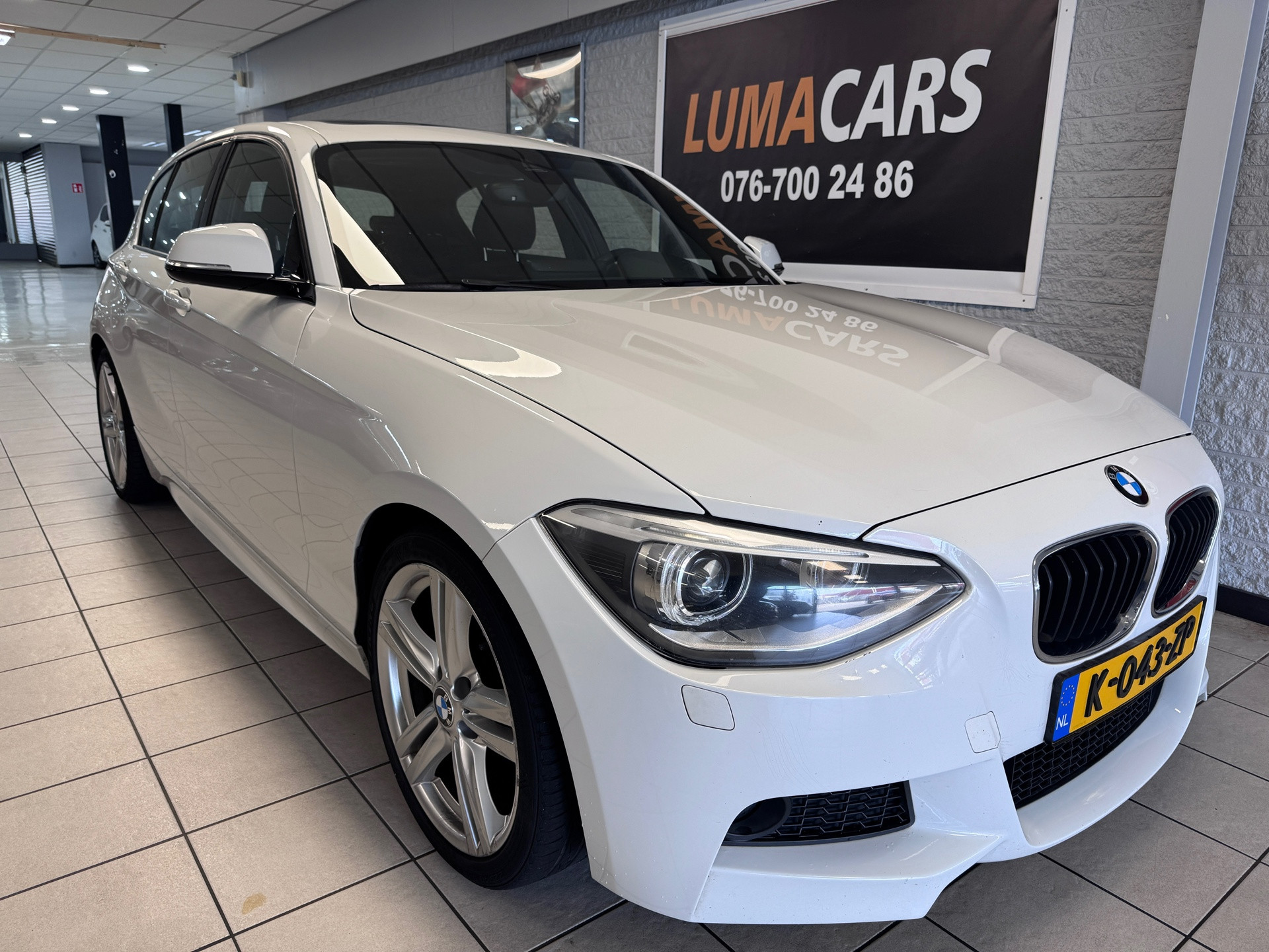 BMW 116i 116i Executive | Nieuwe APK | Pano | Navi | PDC | 2014 - voorkant